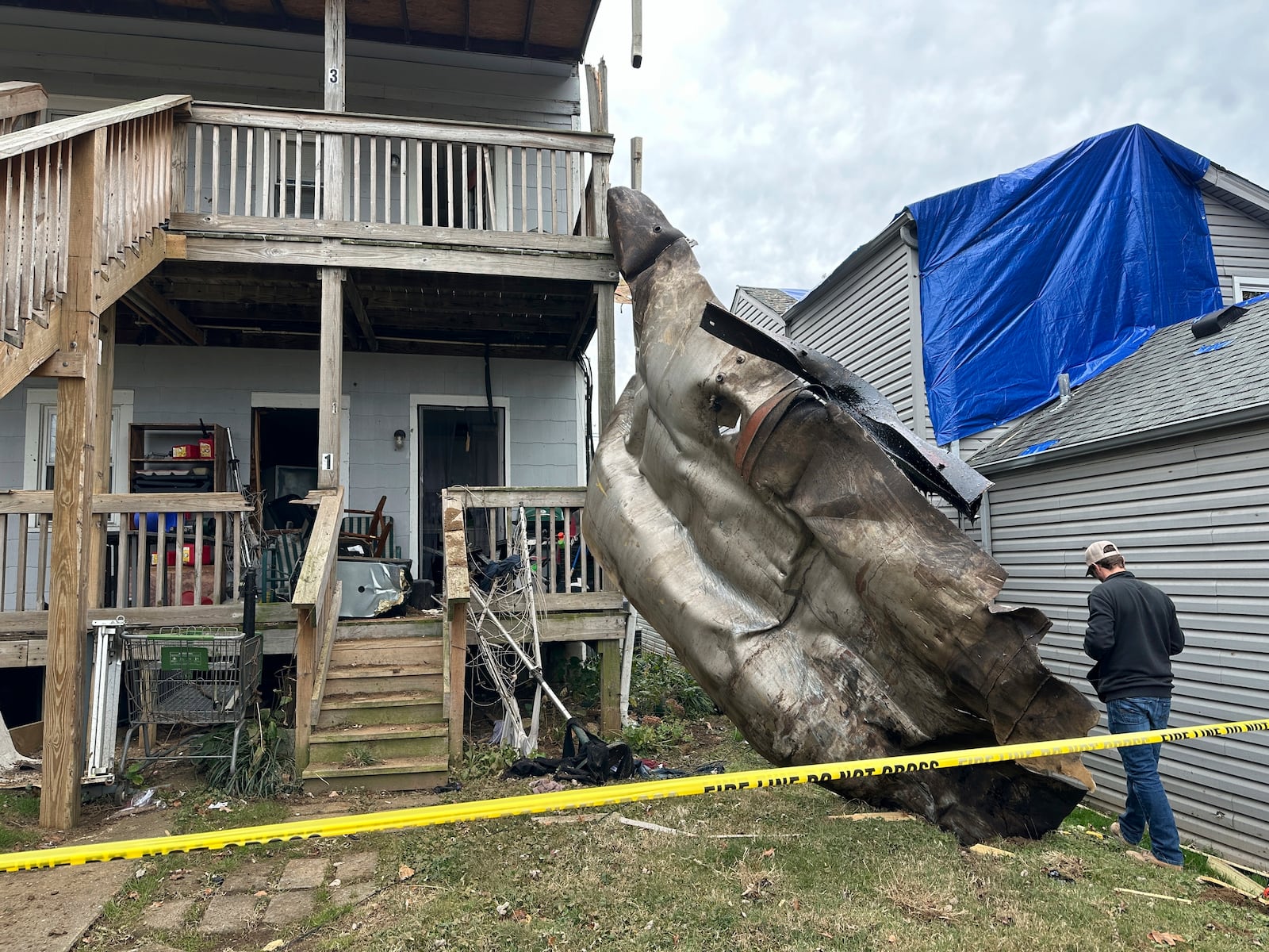 A massive piece of debris that flew from the Givaudan Color Sense plant after an explosion is pictured on Wednesday, Nov. 13, 2024 in Louisville, Ky. (AP Photo/Dylan Lovan)