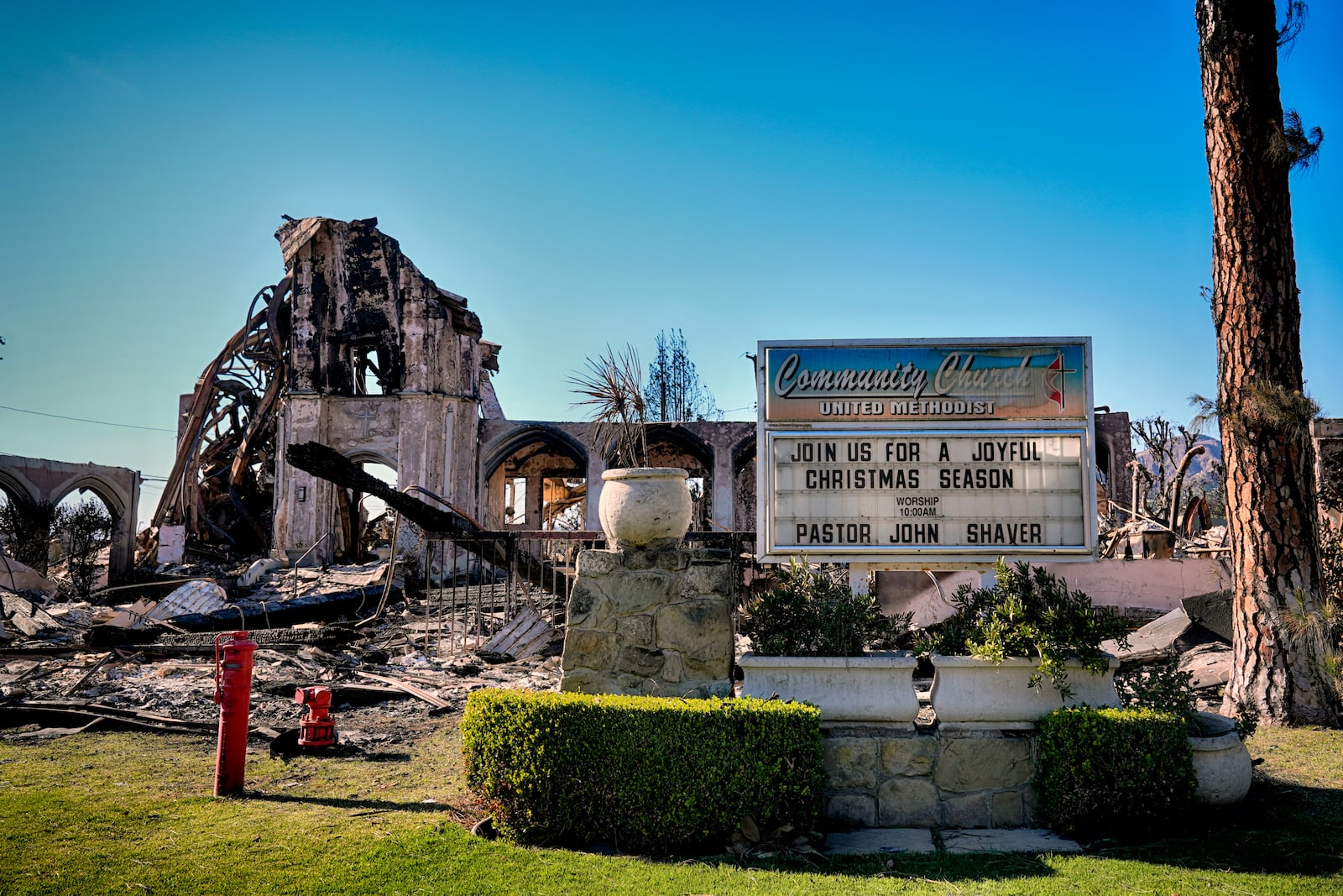 FILE - The remains of the Community United Methodist Church stands amid rubble left from a wildfire that spread through the Pacific Palisades neighborhood of Los Angeles on Wed. Jan. 15, 2025. (AP Photo/Richard Vogel, File)