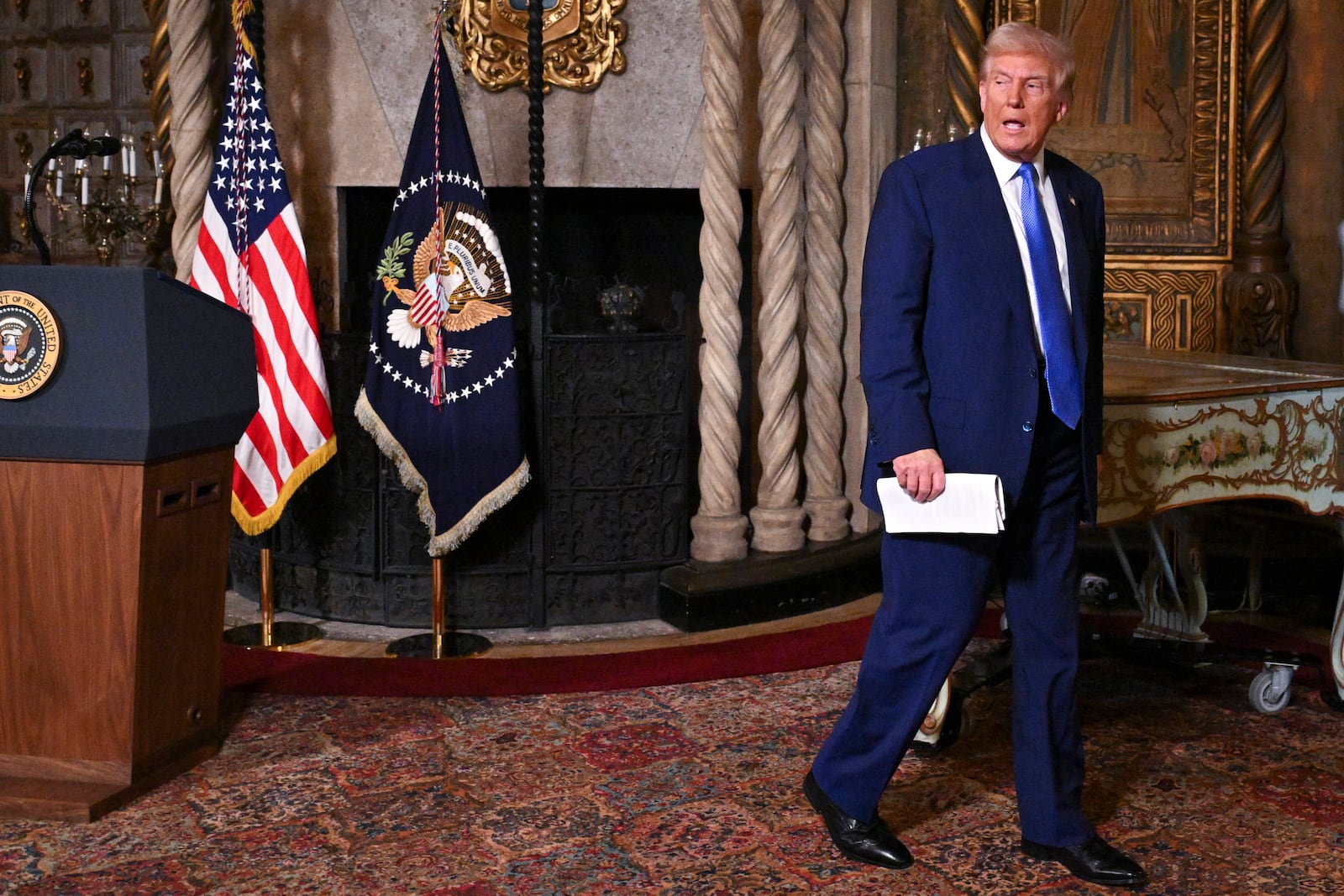 President Donald Trump departs after speaking at Mar-a-Lago in Palm Beach, Fla., Tuesday, Feb. 18, 2025. (Pool via AP)