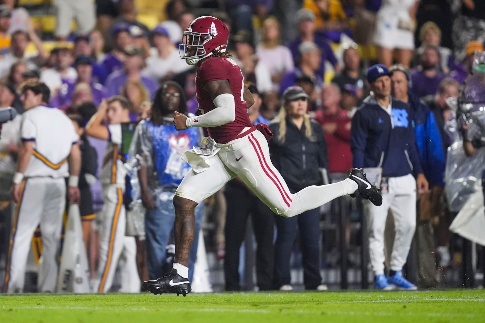 Alabama quarterback Jalen Milroe (4) rushes on a 39 yard touchdown carry in the second half an NCAA college football game in Baton Rouge, La., Saturday, Nov. 9, 2024. (AP Photo/Gerald Herbert)