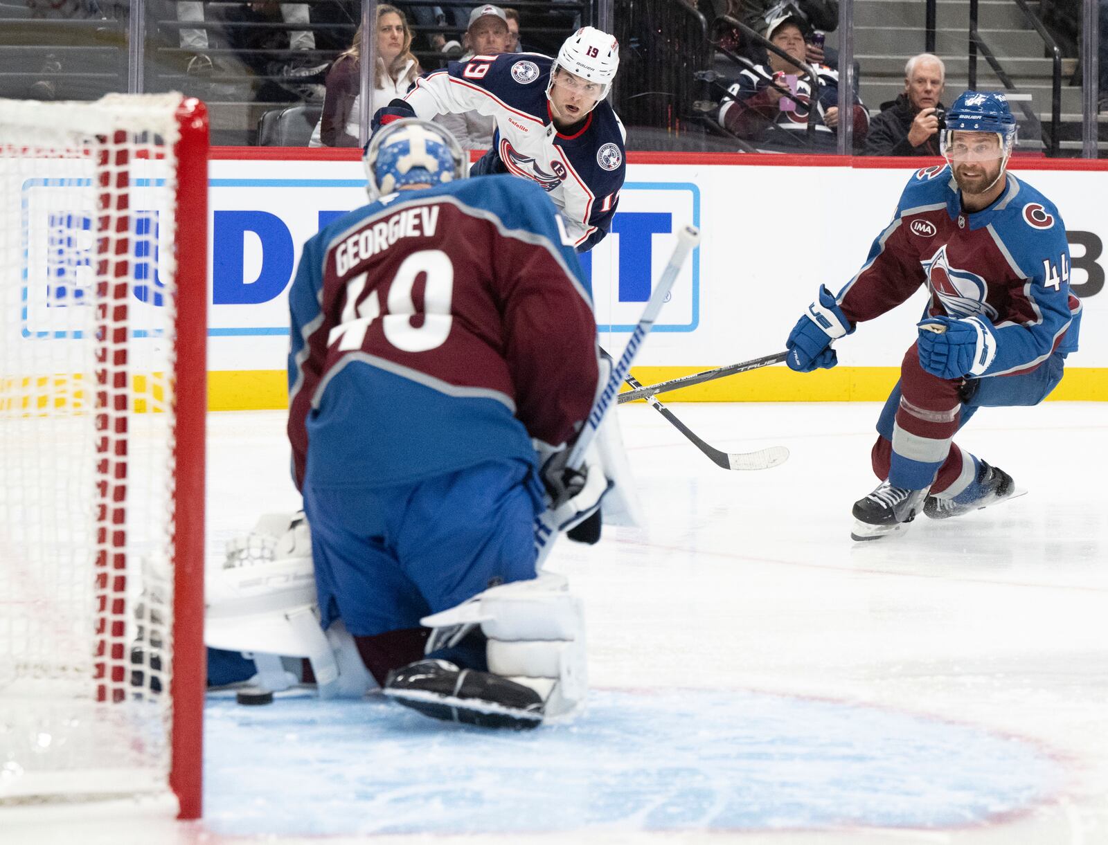 Columbus Blue Jackets center Adam Fantilli (19) scores past Colorado Avalanche goaltender Alexandar Georgiev (40) during the second period of an NHL hockey game, Saturday, Oct. 12, 2024, at Ball Arena in Denver. (Christian Murdock/The Gazette via AP)