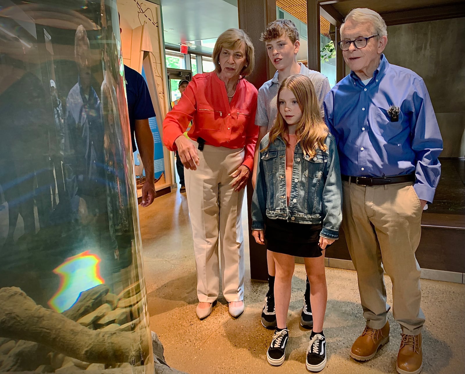 Ohio Governor Mike DeWine and first lady Fran, with grandchildren, Parker and Addie DeWine look at the 20-ft living stream Monday, June 3, 2024 simulating the Little Miami River inside the interpretive center at the Great Council State Park near Xenia. MARSHALL GORBY\STAFF