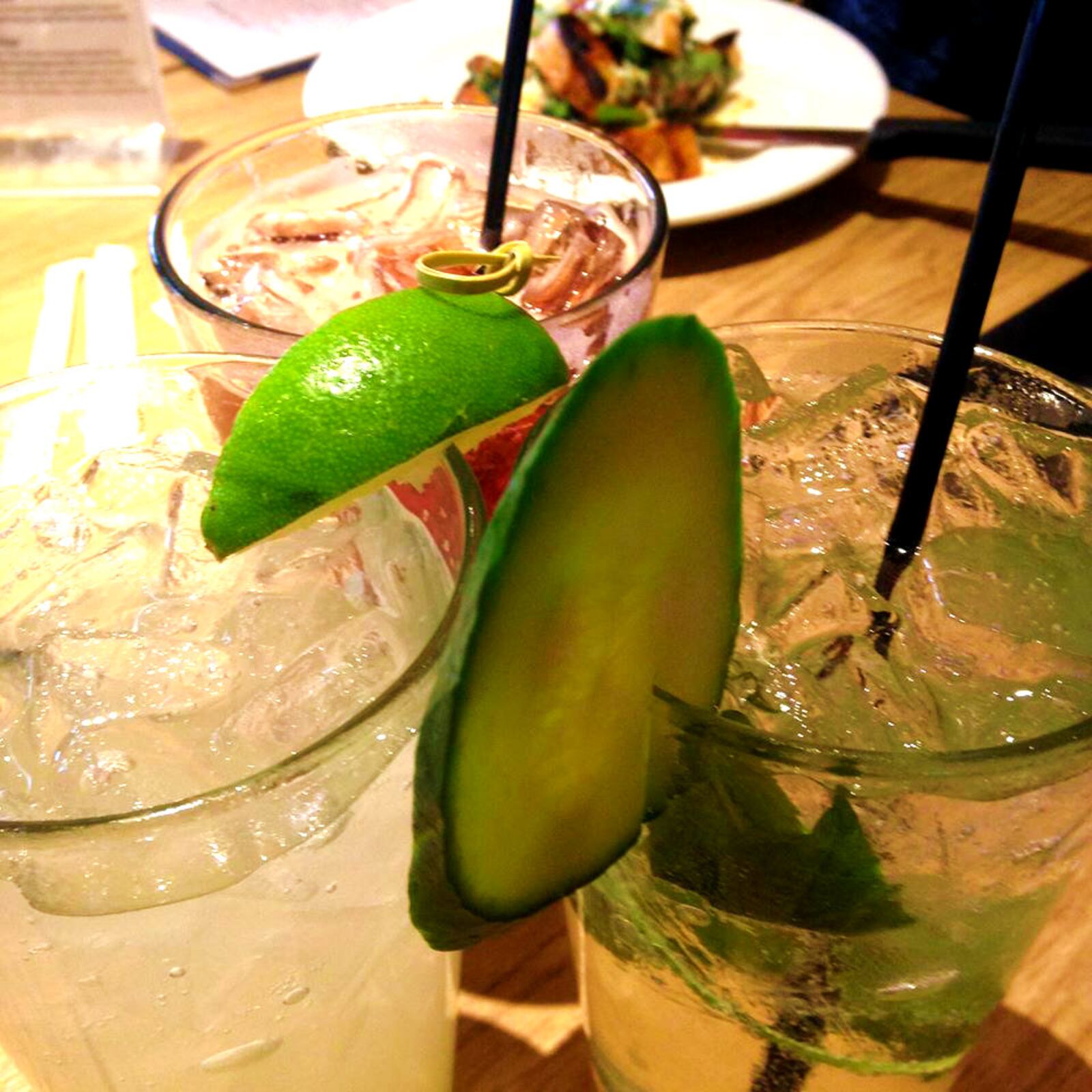 Clockwise from left: Wheat Penny’s housemade limeade, cherry vanilla, and cucumber basil and mint sodas. AMELIA ROBINSON / STAFF