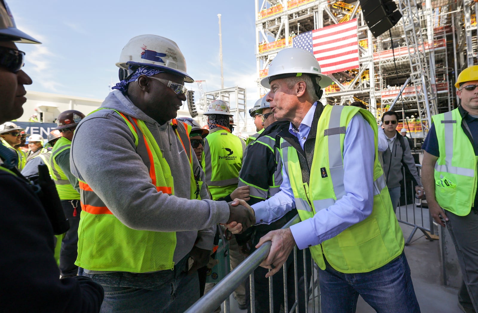 U.S. Secretary of Energy Chris Wright, right, greets workers at Venture Global's Plaquemines LNG export facility Thursday, March 6, 2025, in Plaquemines, La. (Brett Duke/The Advocate via AP)