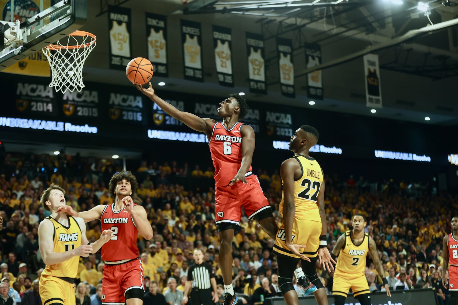 Dayton's Enoch Cheeks scores in the final minute of the first half against Virginia Commonwealth on Friday, Feb. 9, 2024, at the Siegel Center in Richmond, Va. David Jablonski/Staff