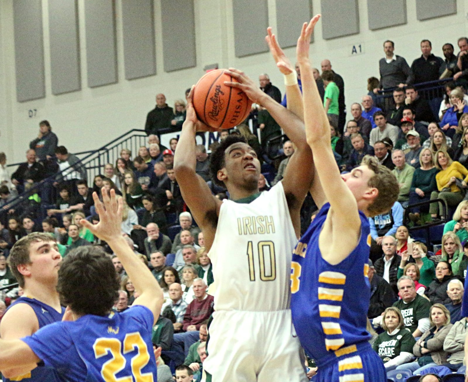 Cenral’s Sabien Doolittle fires a shot. Marion Local defeated Catholic Central 55-33 in a boys D-IV regional semifinal at Fairmont’s Trent Arena in Kettering on Tue., March 13, 2018. GREG BILLING / CONTRIBUTOR