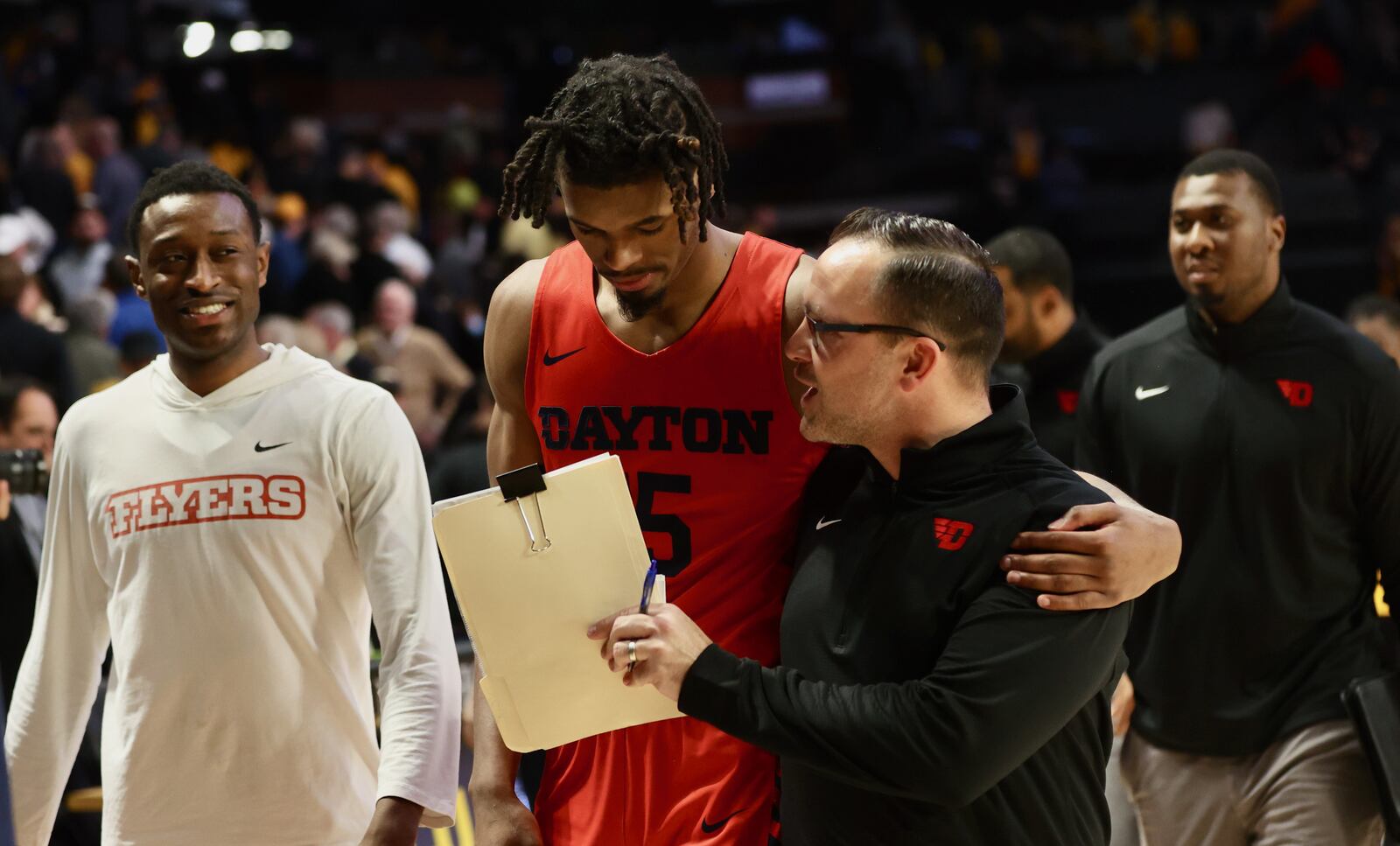 Dayton's DaRon Holmes II and Andy Farrell leave the court after a victory against Virginia Commonwealth on Tuesday, Feb. 7, 2023, at the Siegel Center in Richmond, Va. David Jablonski/Staff