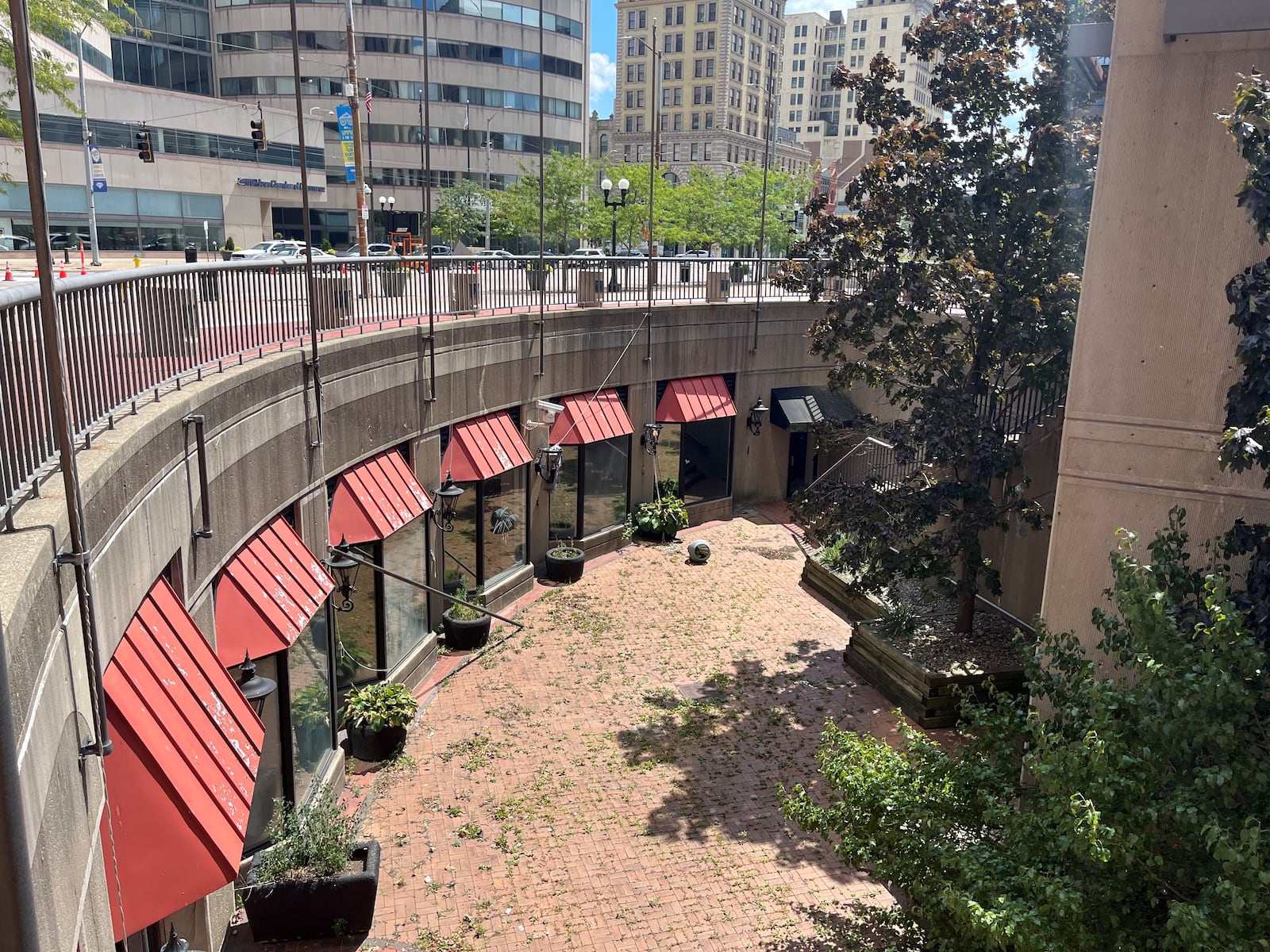 Vacant and shut down commercial spaces that once were home to restaurants in a below-ground space at Courthouse Square. CORNELIUS FROLIK / STAFF