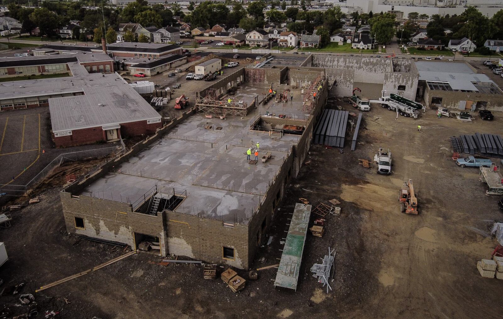 Workers can be seen on the new West Carrollton Intermediate School which will house grades 5-6 starting in fall 2022,  The new school is located at 4100 S. Dixie Drive in Moraine. JIM NOELKER/STAFF