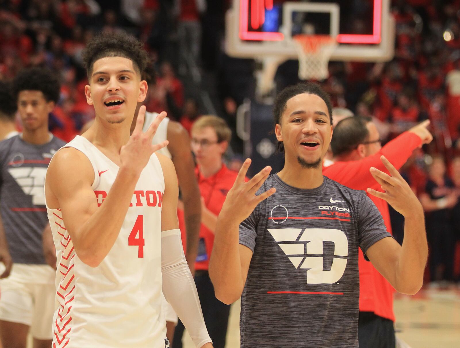 Dayton's Koby Brea and Christian Wilson leave the court after a victory against Illinois-Chicago on Tuesday, Nov. 9, 2021, at UD Arena. David Jablonski/Staff