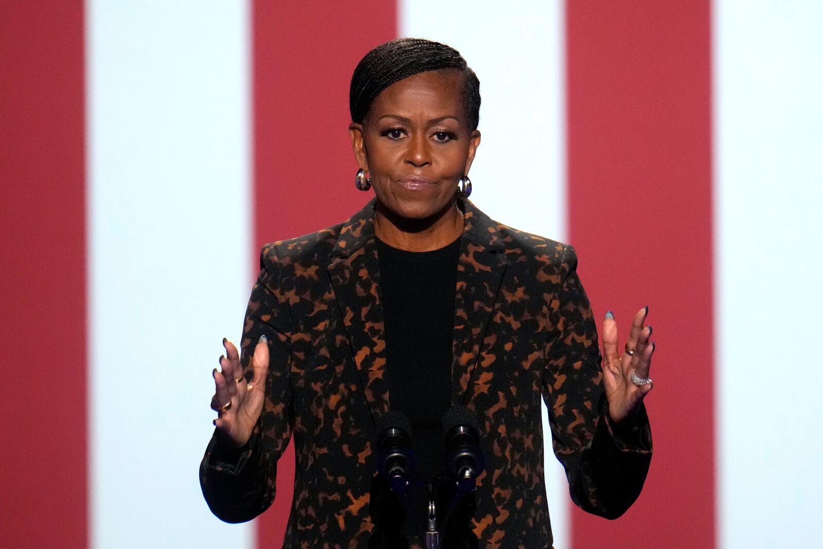 Former first lady Michelle Obama speaks at a campaign rally for democratic presidential nominee Vice President Kamala Harris at the Wings Event Center, in Kalamazoo, Mich., Saturday, Oct. 26, 2024. (AP Photo/Paul Sancya)