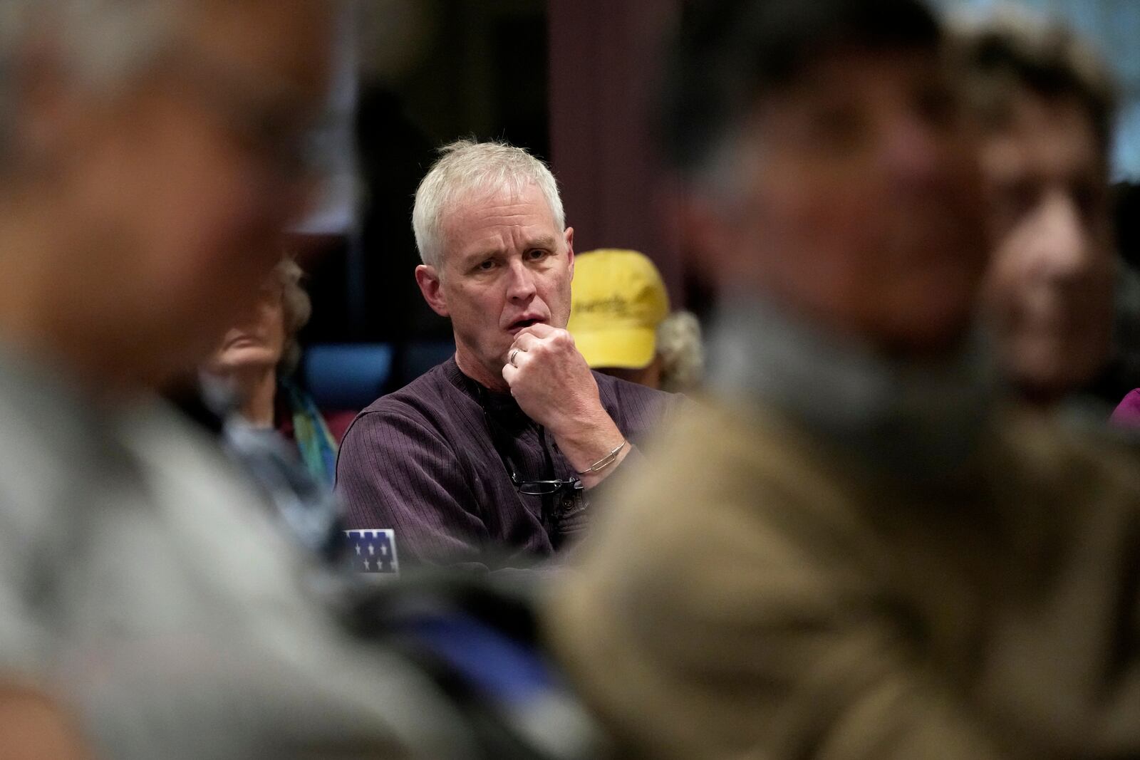 Tom Varley listens during a town hall meeting at the George Culver Community Library Thursday, March 6, 2025, in Sauk City, Wis. (AP Photo/Morry Gash)