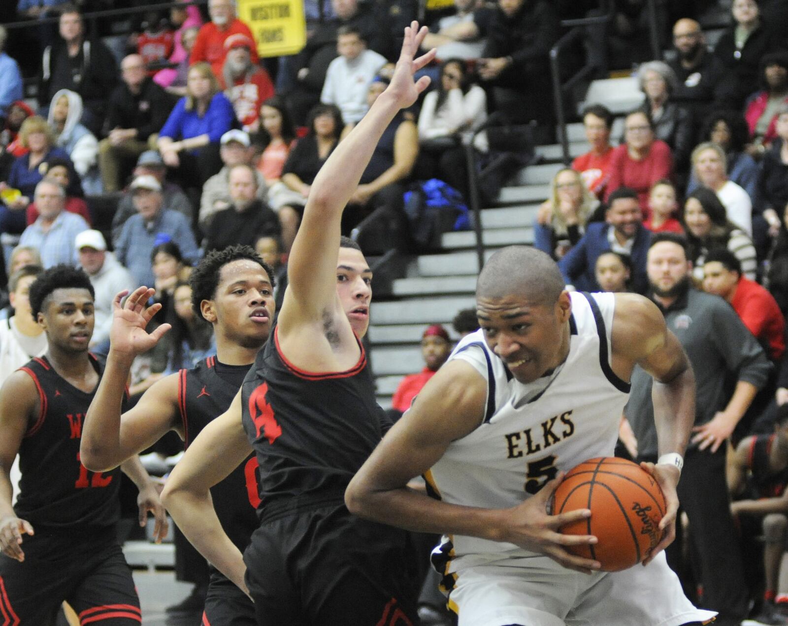 Mo Njie of Centerville (with ball) takes on Brian Hill of Wayne. Centerville defeated visiting Wayne 69-44 in a boys high school basketball game on Friday, Feb. 15, 2019. MARC PENDLETON / STAFF