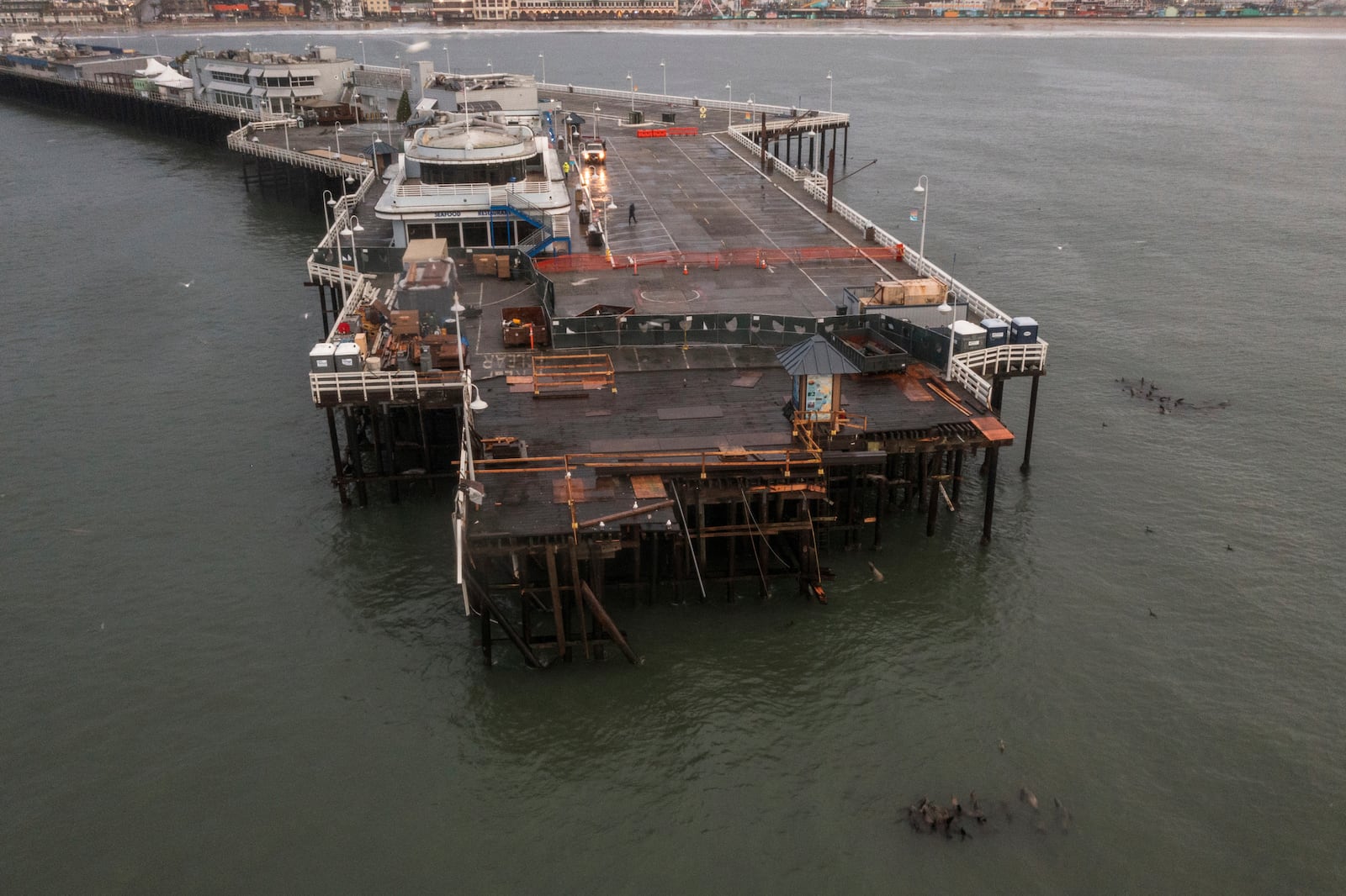 Damage to the Santa Cruz Wharf is seen in Santa Cruz, Calif., Tuesday, Dec. 24, 2024. (AP Photo/Nic Coury)