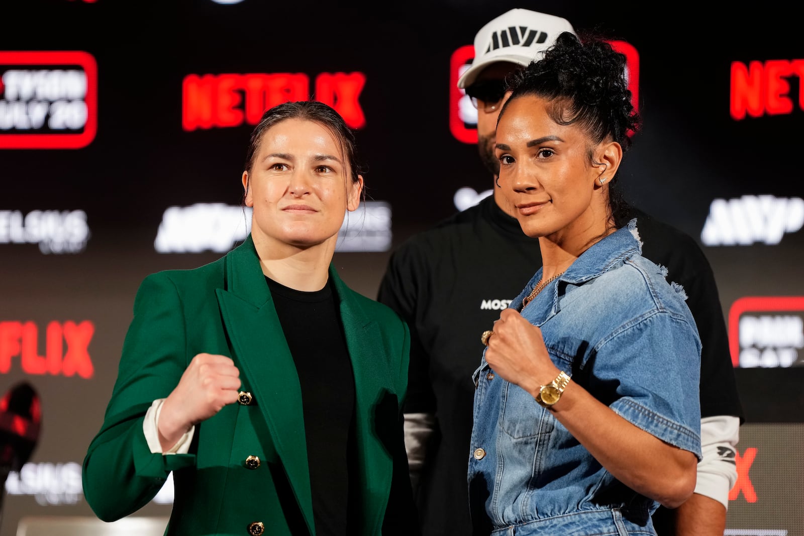 FILE - Katie Taylor, left, and Amanda Serrano pose for photos during a news conference promoting their upcoming boxing bout, Thursday, May 16, 2024, in Arlington, Texas. (AP Photo/Sam Hodde, File)