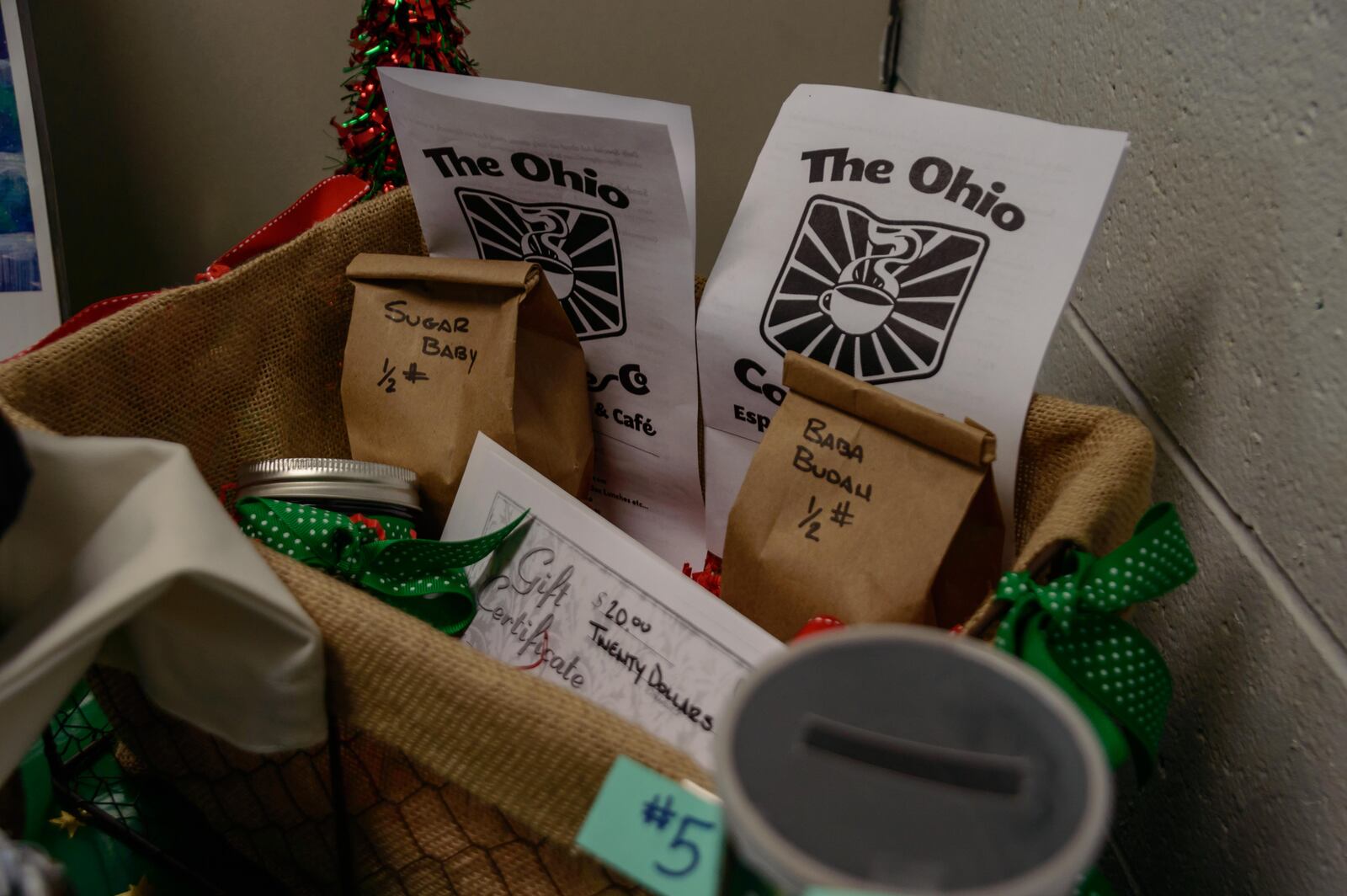 Local vendors set up shop with handmade wares to give and get for the holidays at the Old Yellow Cab Tavern in Dayton. (TOM GILLIAM)