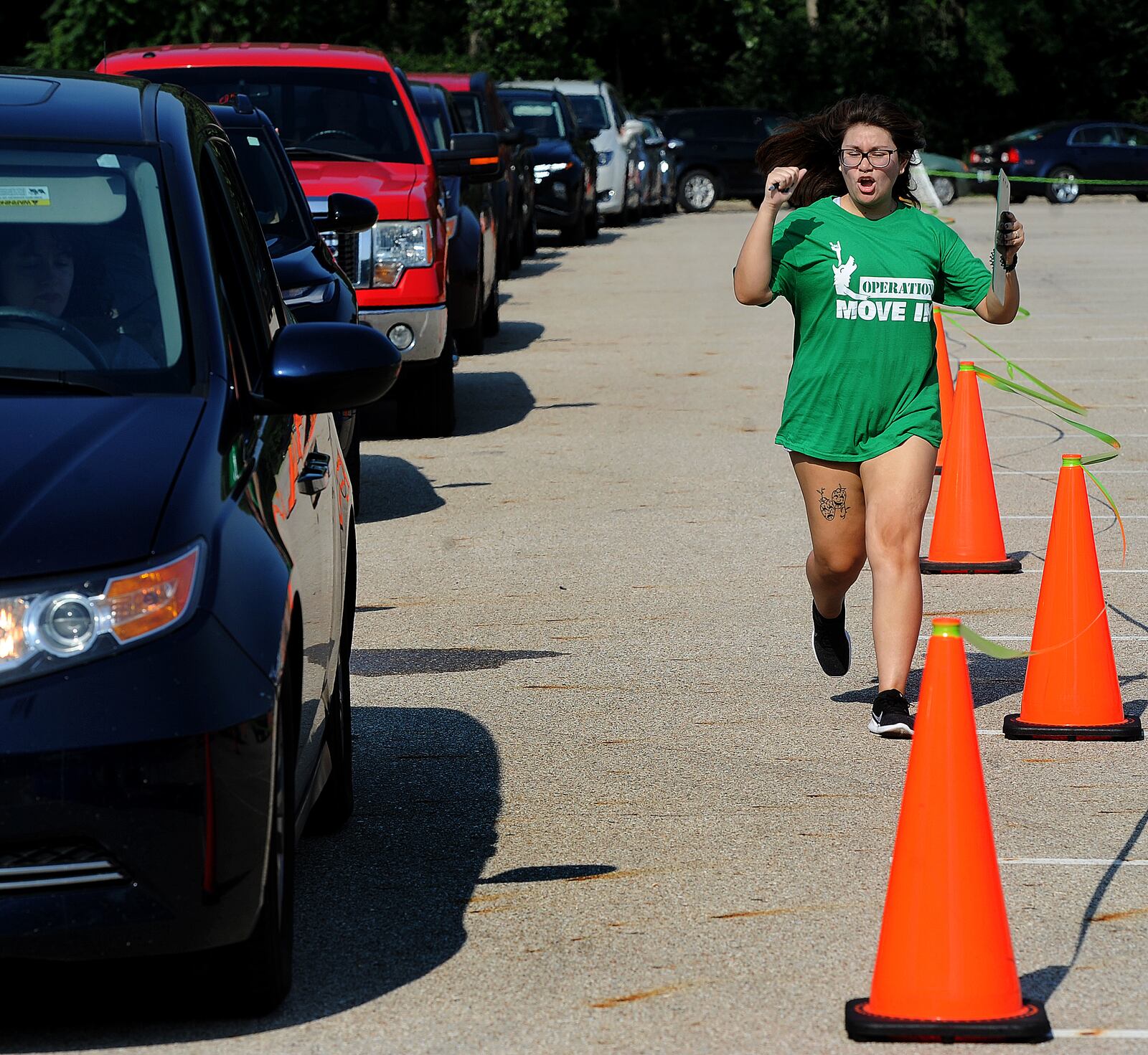 The Wright State University Operation Move In volunteer Marcela Gallegos-Holguin shows her enthusiasm for Move In day Wednesday, Aug. 23, 2023. MARSHALL GORBY\STAFF







