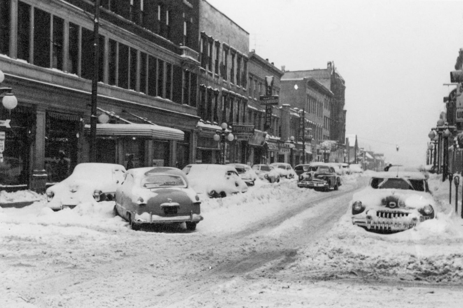 The days after Thanksgiving in 1950 brought record-setting snow in a storm that blanketed the county leaving many people stuck and giant piles of snow everywhere, but also beautiful scenes like this one looking east down Main Street from Limestone. Photo are from the W. Huston Moores Collection at the Clark County Historical Society.