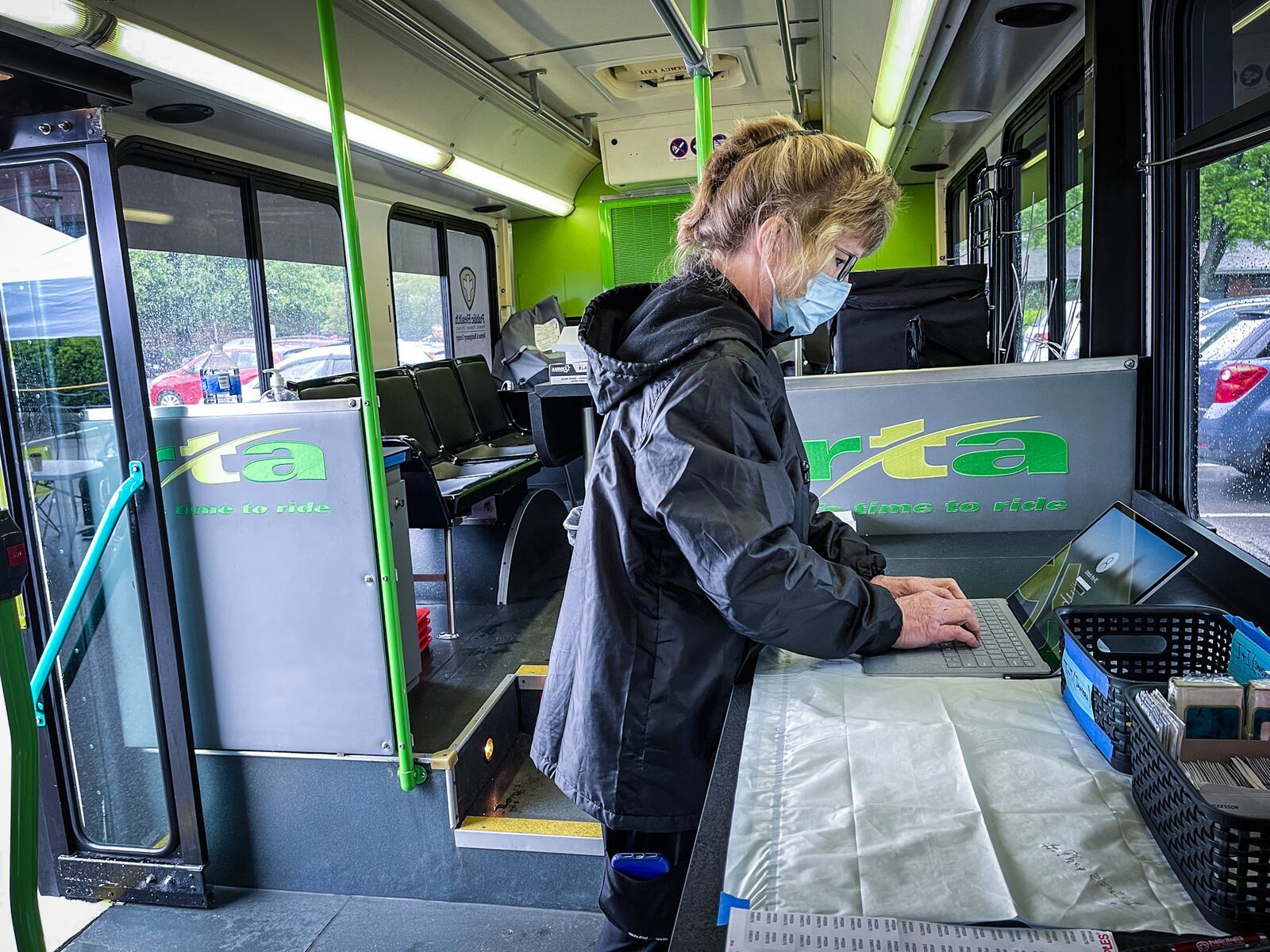 Dayton Montgomery Public Health nursing supervisor, Wendy Martin gets reading to vaccinate people on a converted RTA bus at the Wheat Penny on Wayne Ave. Monday. JIM NOELKER\STAFF