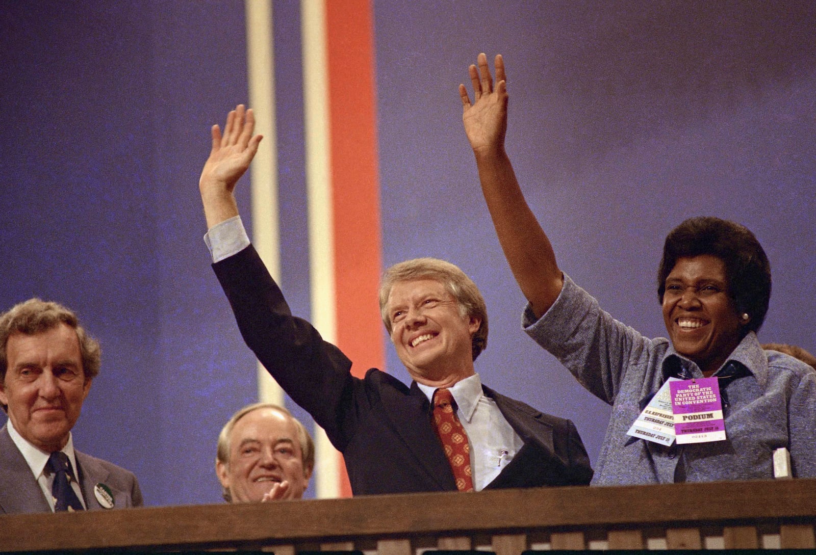 FILE - Democratic presidential candidate Jimmy Carter and Rep. Barbara Jordan, D-Texas, wave at the Democratic National Convention in New York's Madison Square Garden where Jordan gave a speech on July 12, 1976. (AP Photo)