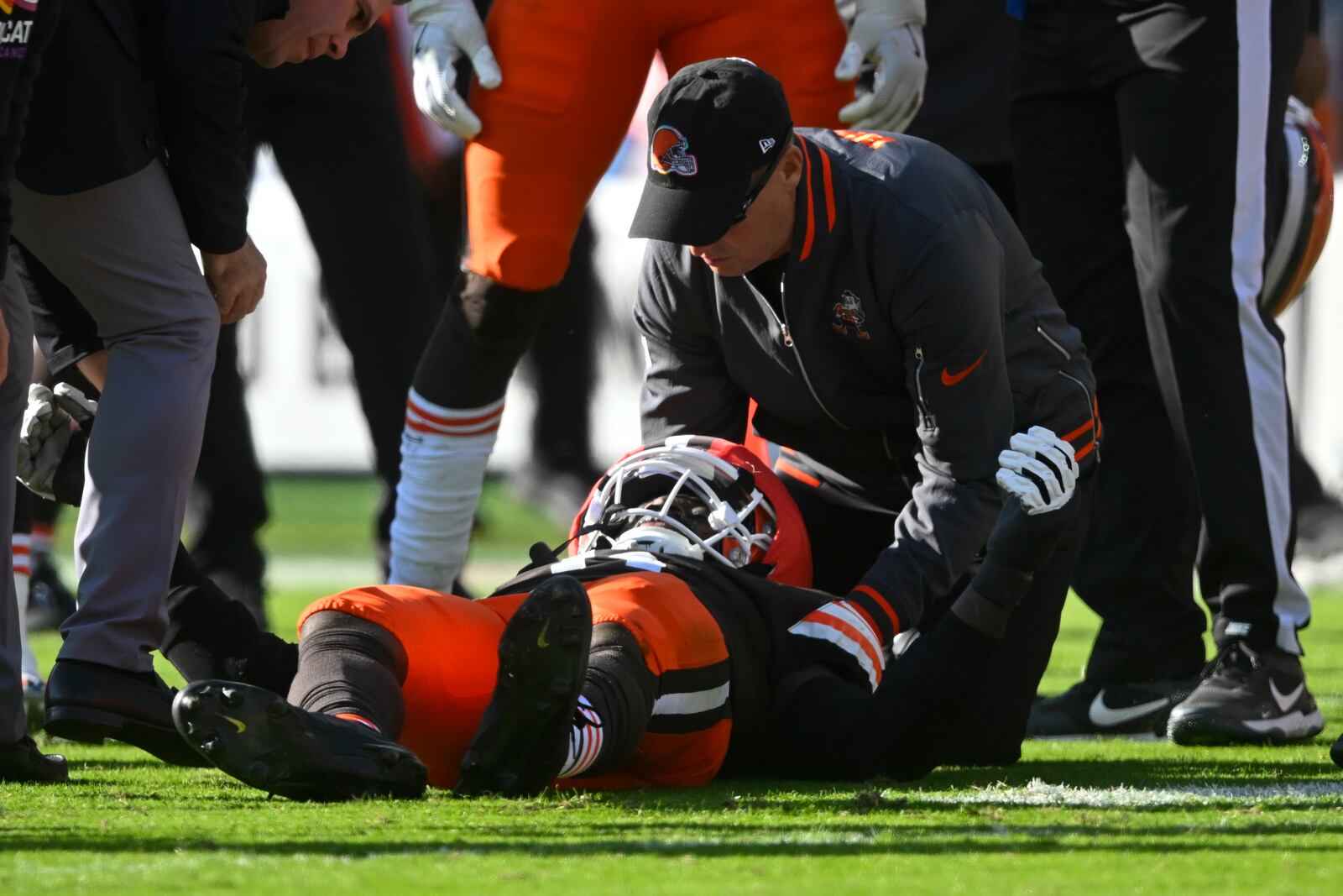 Cleveland Browns linebacker Jeremiah Owusu-Koramoah (6) is checked on the field during the second half of an NFL football game against the Baltimore Ravens in Cleveland, Sunday, Oct. 27, 2024. (AP Photo/David Richard)