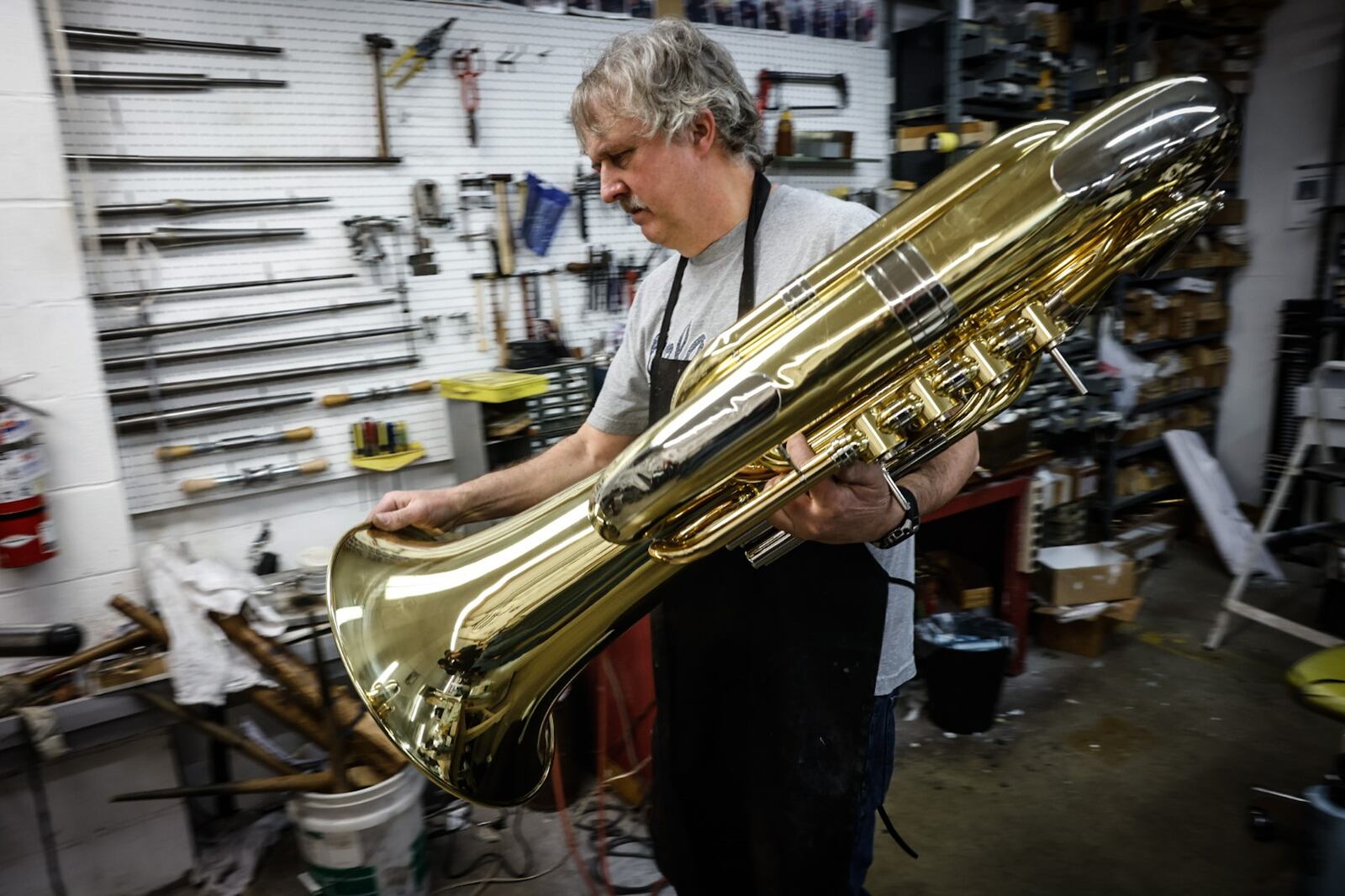 Hauer Music repair technician Gary Dafler has worked on instruments played by Doc Severinsen and Wynton Marsalis. JIM NOELKER/STAFF