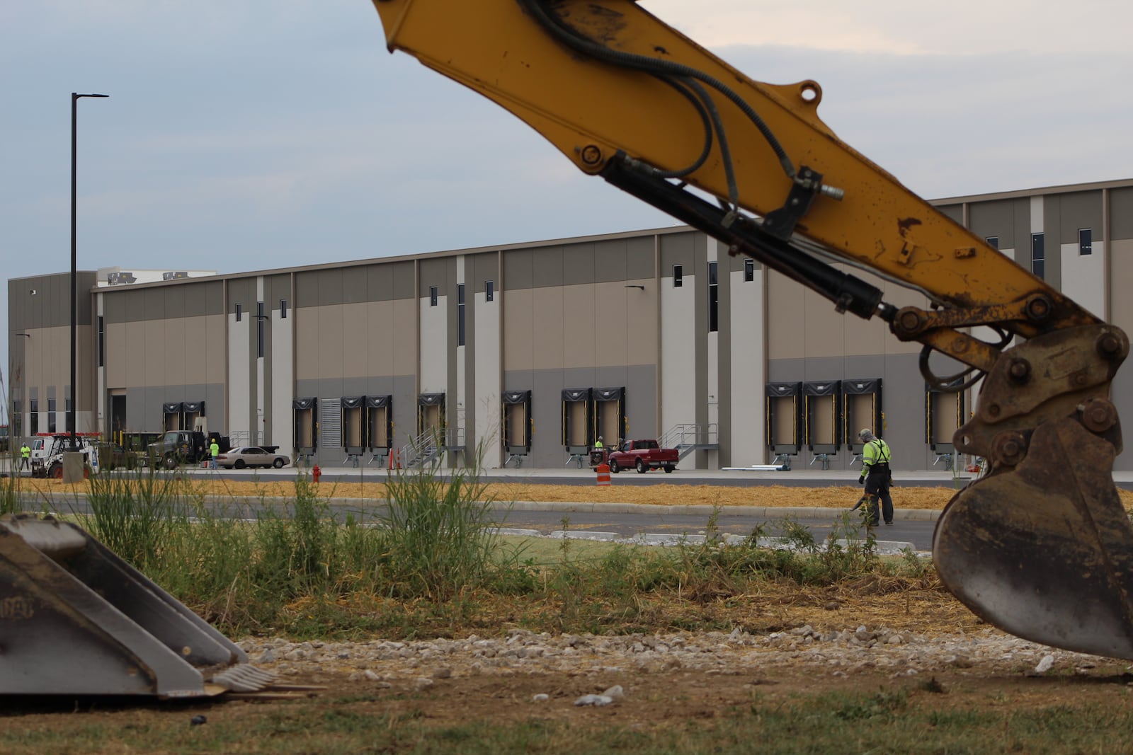 Crews work outside of a building under construction at the Dayton International Airport by NorthPoint Development. The company wants to build a fifth building at the airport. CORNELIUS FROLIK / STAFF