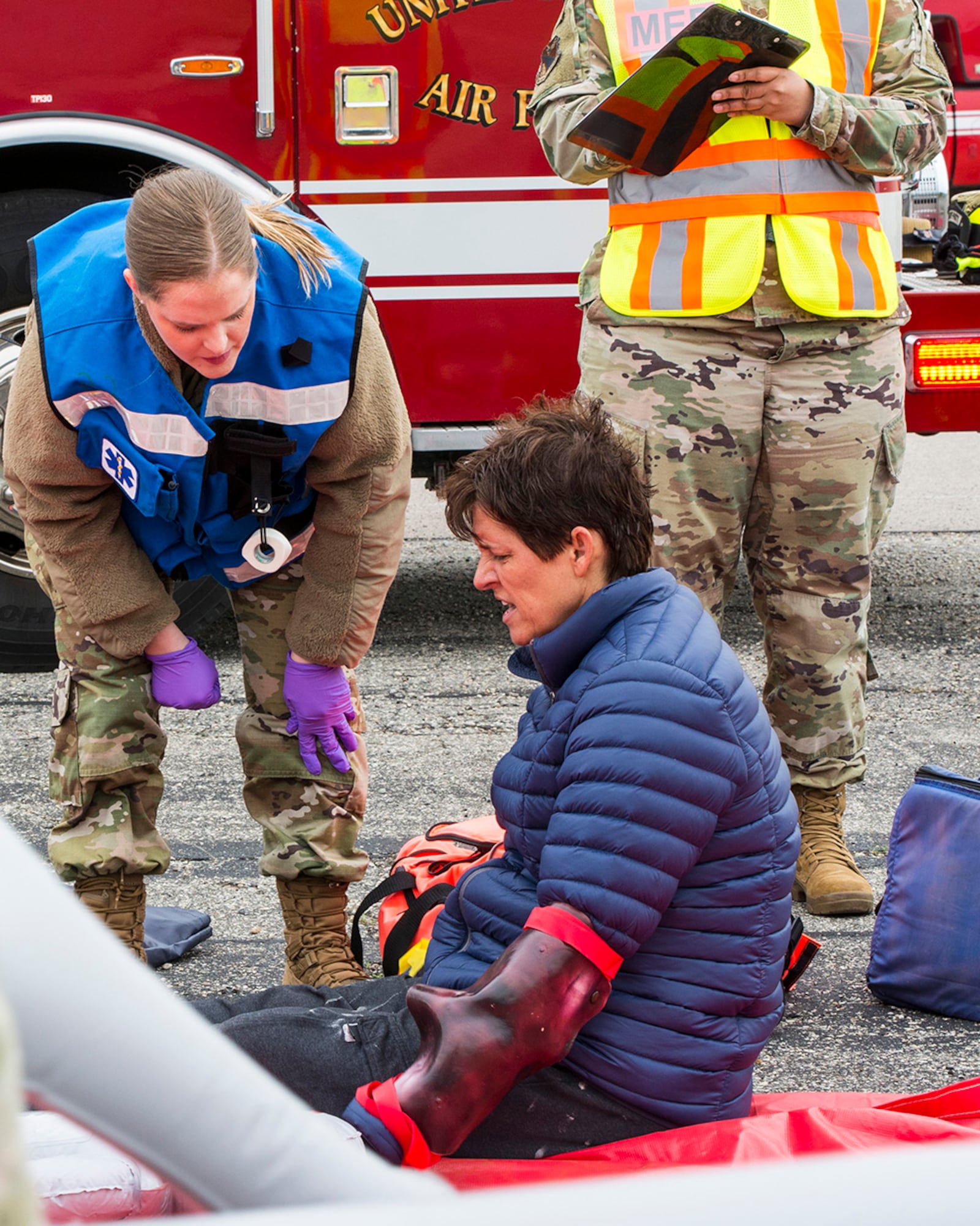 An emergency responder from the 88th Medical Group triages a victim during a mass casualty exercise on May 5. U.S. AIR FORCE PHOTO/JAIMA FOGG