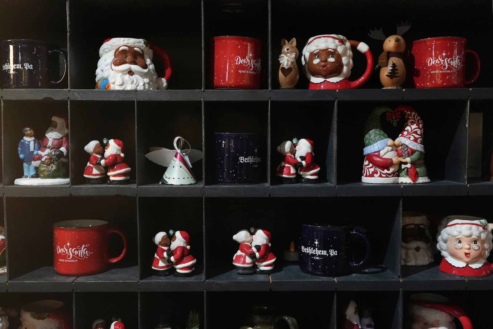 Christmas mugs and decorations on display at a store in Bethlehem, Pa., on Sunday, Friday, Nov. 29, 2024. (AP Photo/Luis Andres Henao)