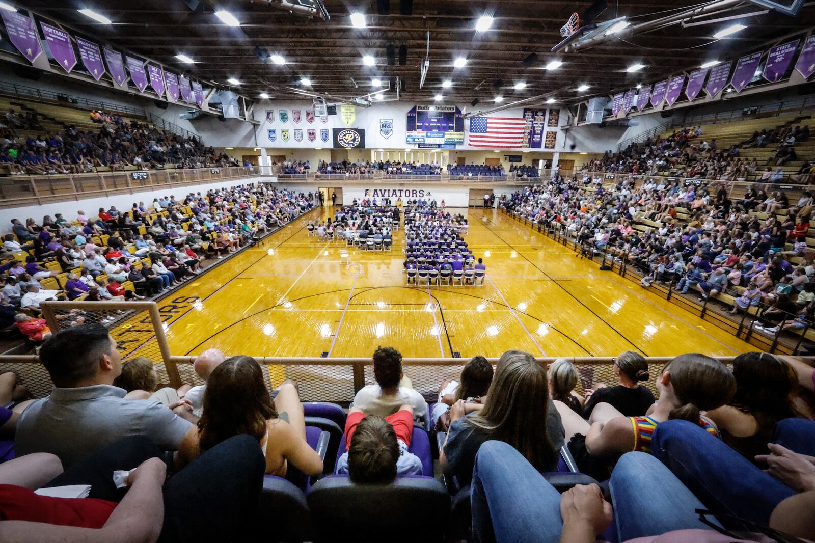 A large crowd of mourners attend a vigil Monday, Aug. 8, 2022, at Butler High School in honor of four Butler Twp. residents — Clyde, 82, and his wife, Eva "Sally" Knox, 78, and Sarah Anderson, 41, and her daughter, 15-year-old Kayla Anderson, a student at Butler High School, who were gunned down Friday on Hardwicke Place.  JIM NOELKER/STAFF