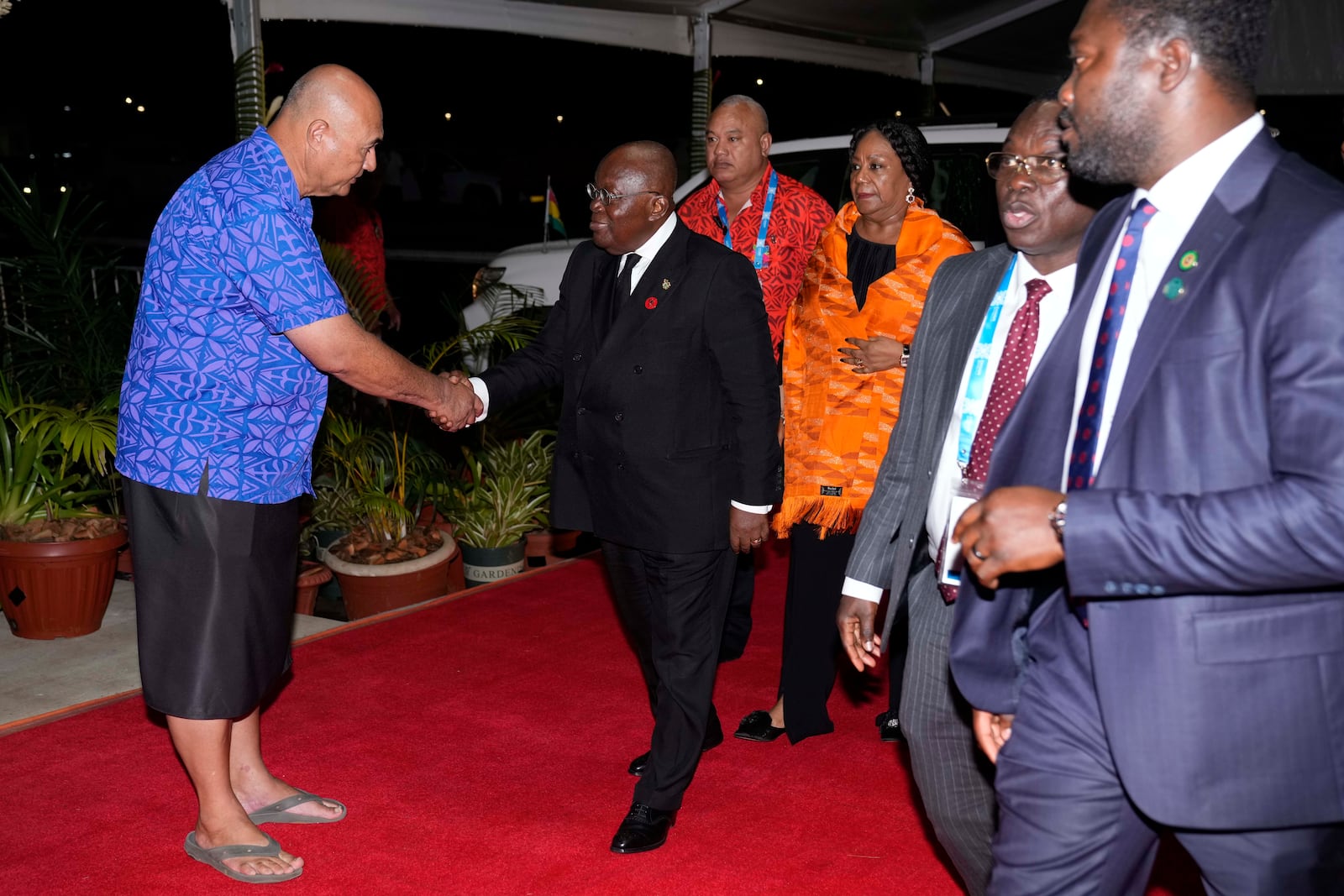 Samoan Deputy Prime Minister Tuala Iosefo Ponifasio, left, greets President of Ghana Nana Akufo-Addo at the official welcome reception for the Commonwealth Heads of Government meeting in Apia, Samoa, Thursday, Oct. 24, 2024. (AP Photo/Rick Rycroft/Pool)