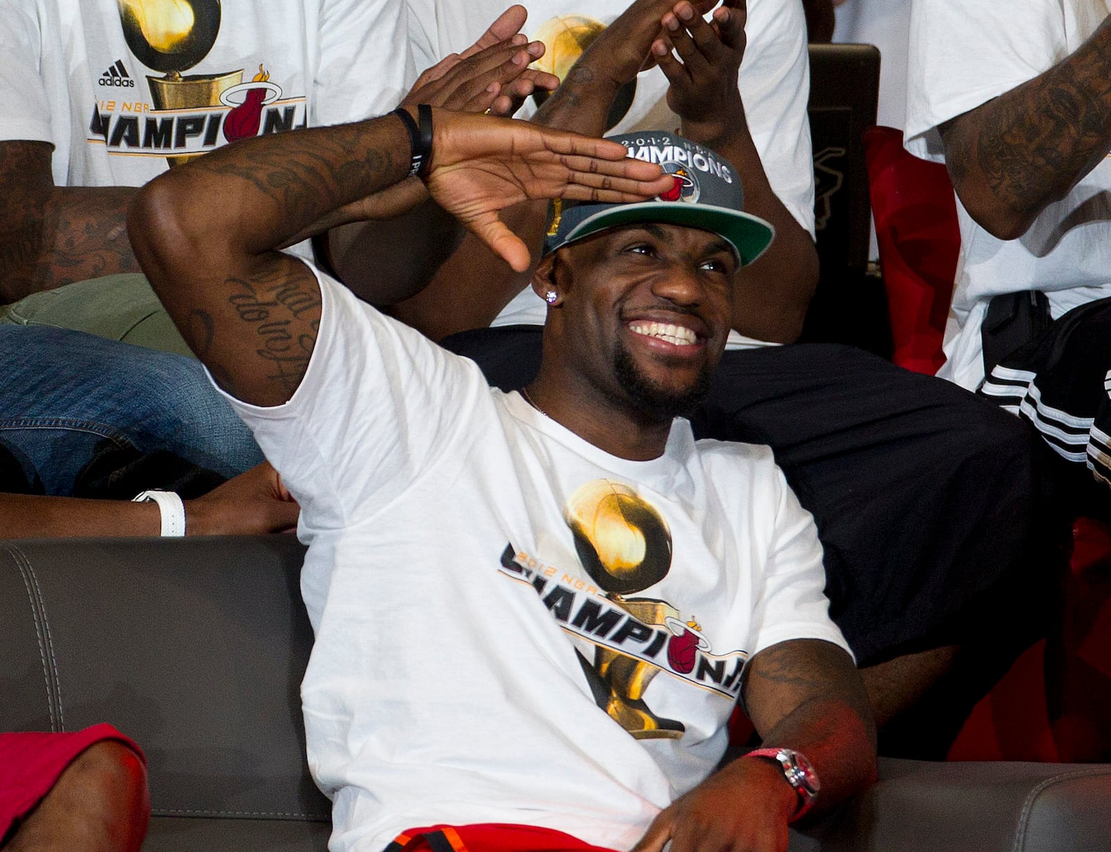 FILE - Miami Heat's LeBron James reacts to the crowd during a public celebration for the NBA Champions in Miami, on June 25, 2012. (AP Photo/J Pat Carter, File)