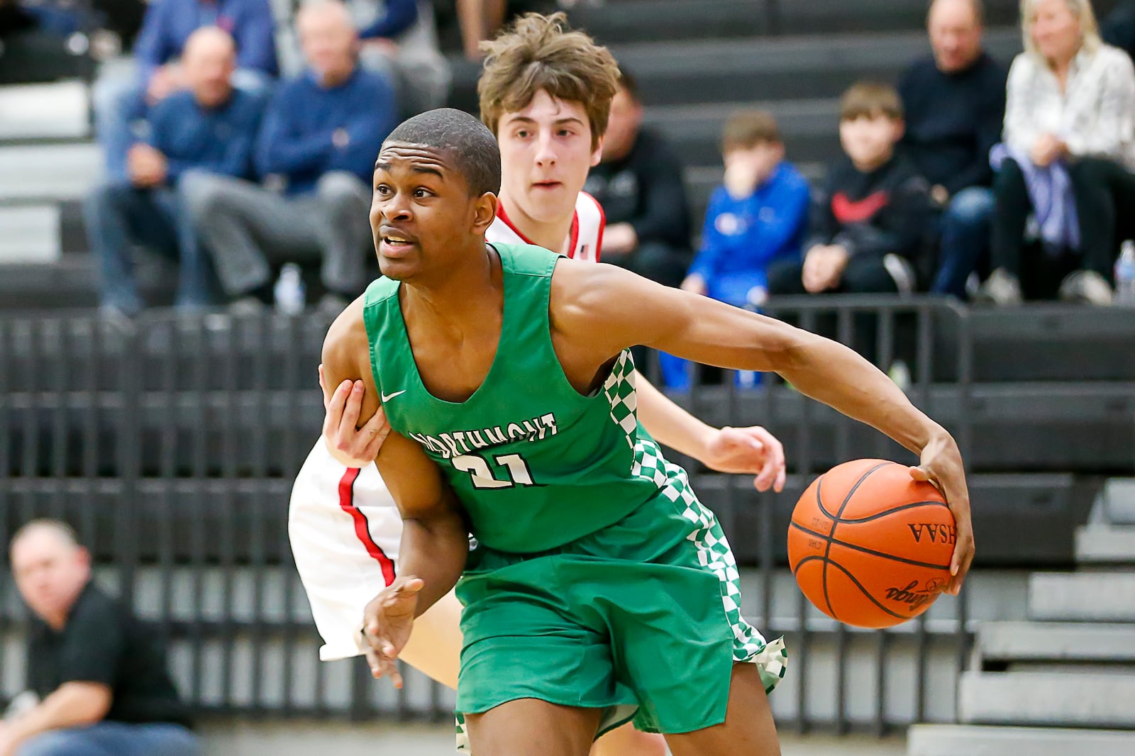 Northmont High School senior Kennez Bozeman drives past Franklin's Ashton Everitt during their game on Monday, Feb. 21 at Centerville High School. CONTRIBUTED PHOTO BY MICHAEL COOPER