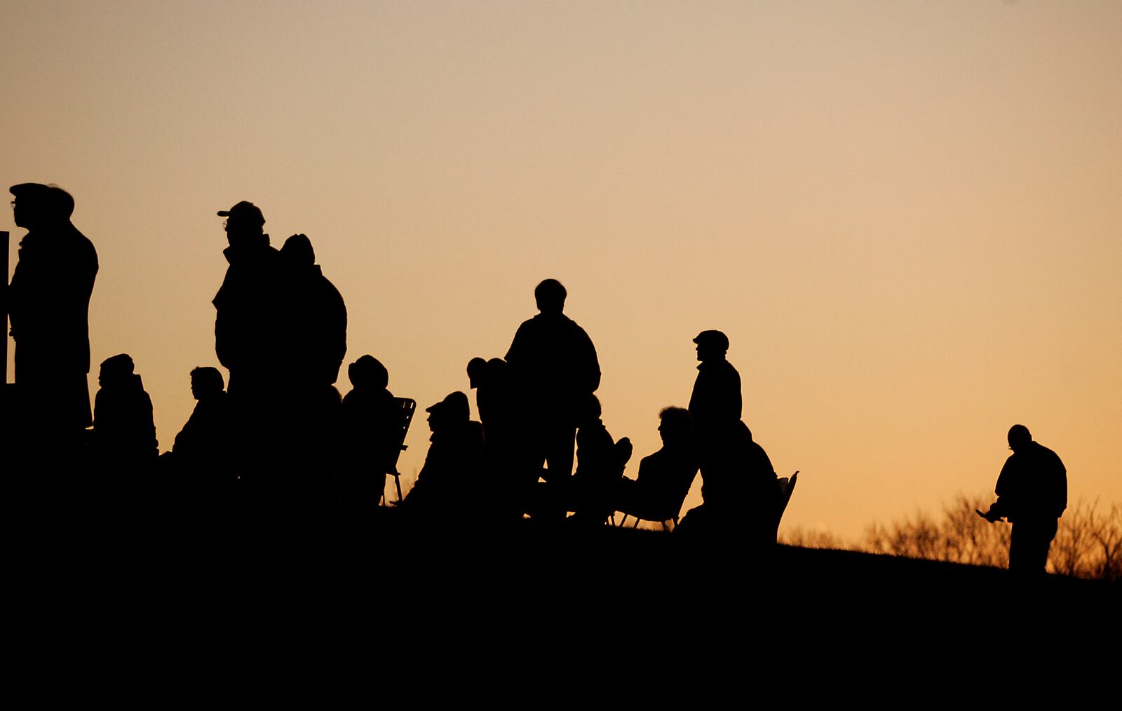 Worshippers stand during a reading during the Easter Sunrise Service April 4, 2010 at Carillon Historical Park, 1000 Carillon Blvd., Dayton sponsored by Dayton History and Greater Dayton Christian Connections.Staff photo by Jim Witmer