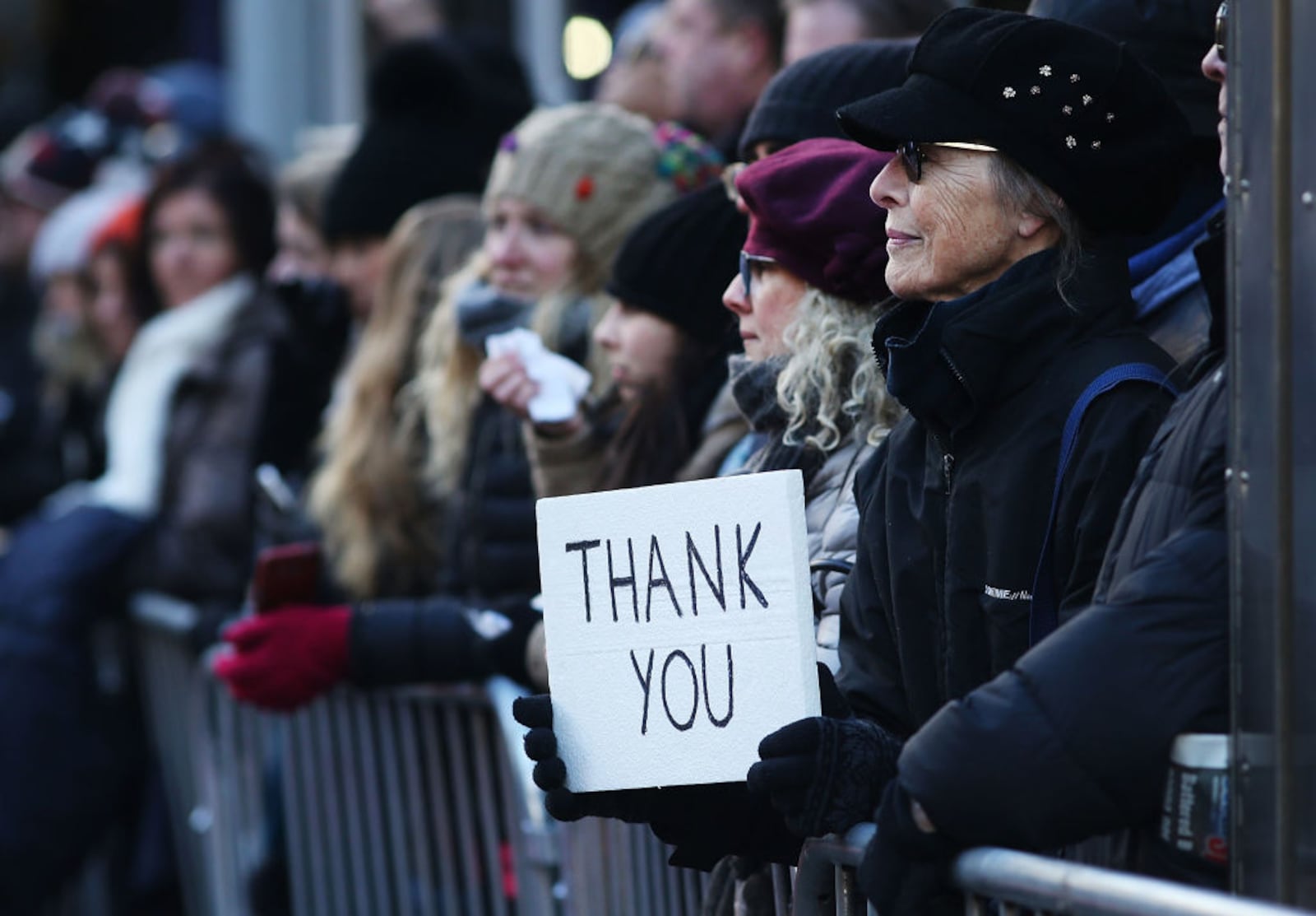 NEW YORK, NY - NOVEMBER 11:  A woman holds a sign thanking veterans during the Veterans Day Parade on November 11, 2017 in New York City. The largest Veterans Day event in the nation, this year's parade features thousands of marchers, including military units, civic and youth groups, businesses and high school bands from across the country and veterans of all eras. The U.S. Air Force is this year's featured service and the grand marshal is space pioneer Buzz Aldrin.  (Photo by Spencer Platt/Getty Images)