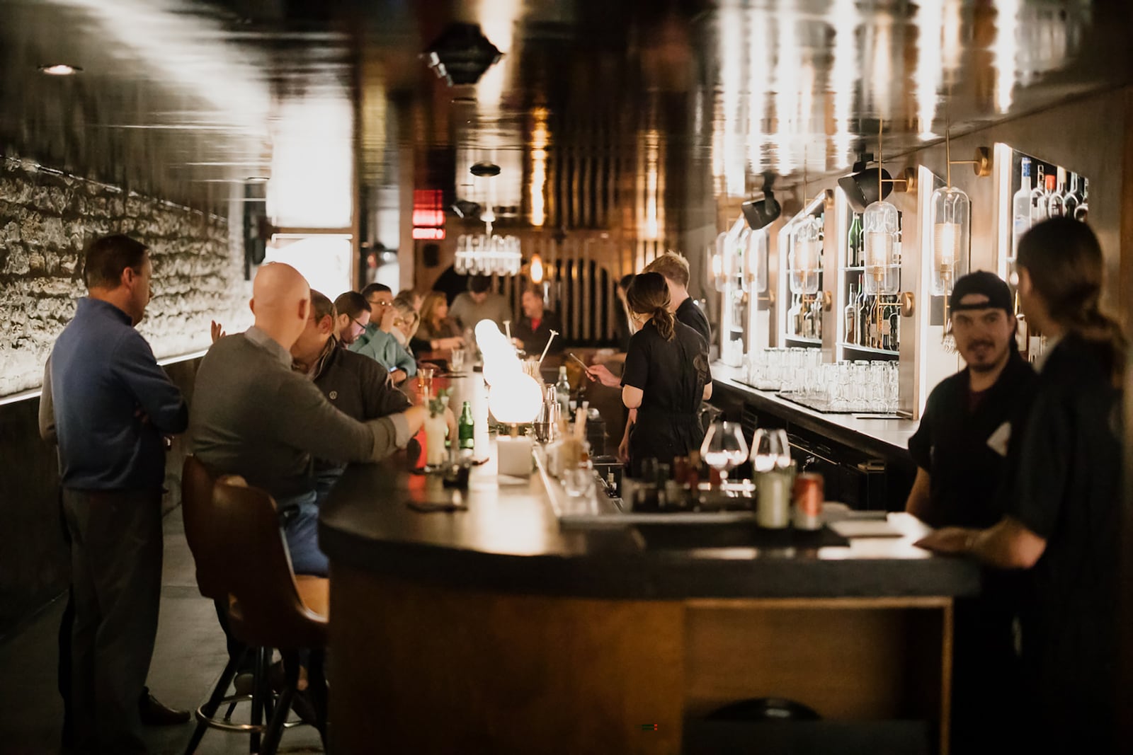 Staff and guests at Tender Mercy shortly before it closed, along with all other bars and restaurants, in March of 2020. The downtown Dayton bar is described as "part grunge, part glamour with a pinch of groovy." CONTRIBUTED