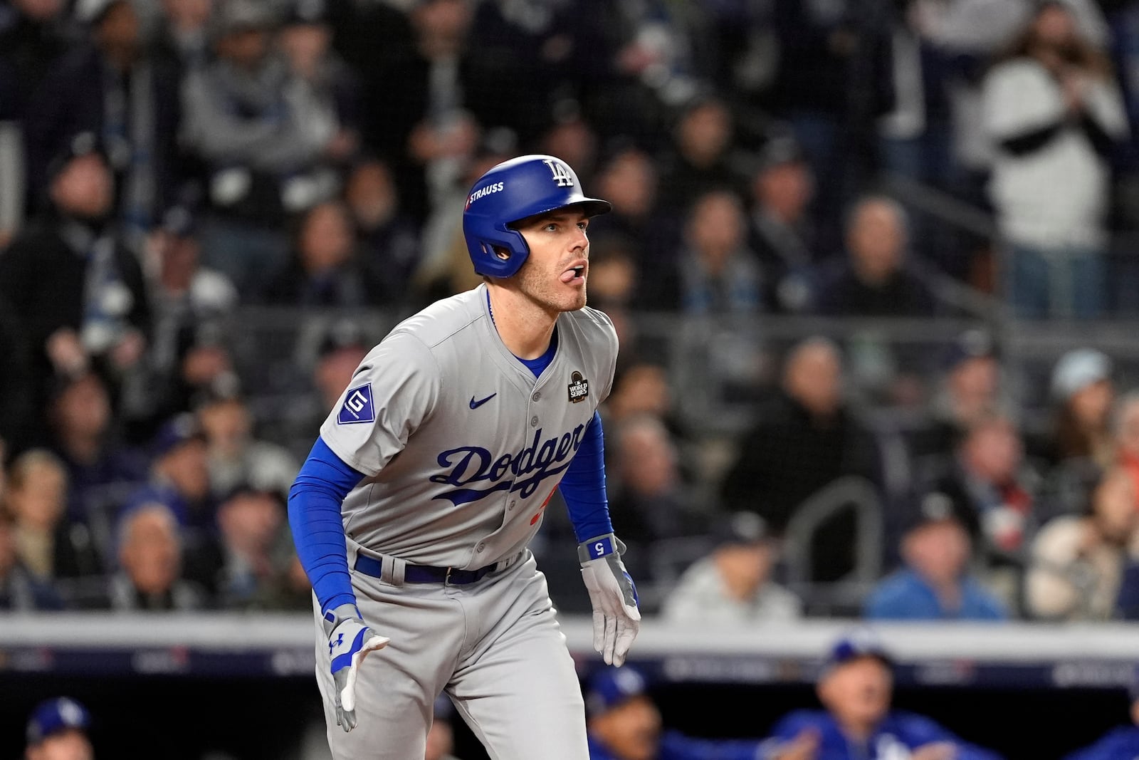 Los Angeles Dodgers' Freddie Freeman watches his two-run home run against the New York Yankees during the first inning in Game 3 of the baseball World Series, Monday, Oct. 28, 2024, in New York. (AP Photo/Godofredo A. Vásquez)