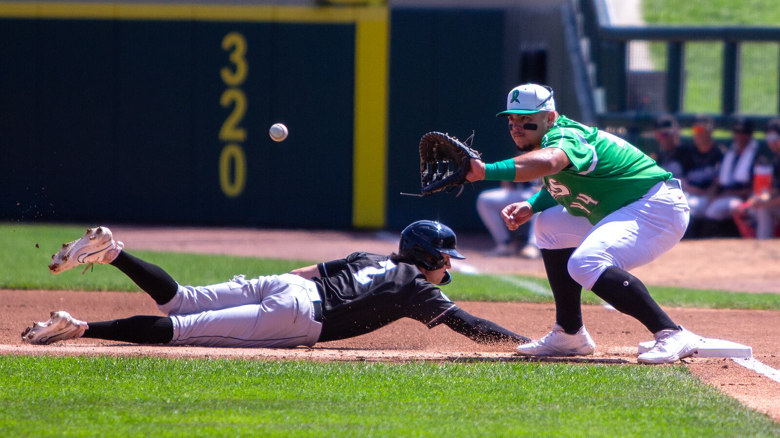 Dayton first baseman Ruben Ibarra catches a pickoff attempt from pitcher Carson Rudd during a 2023 game at Day Air Ballpark. Lansing's Jacob Wilson was safe. Jeff Gilbert/CONTRIBUTED