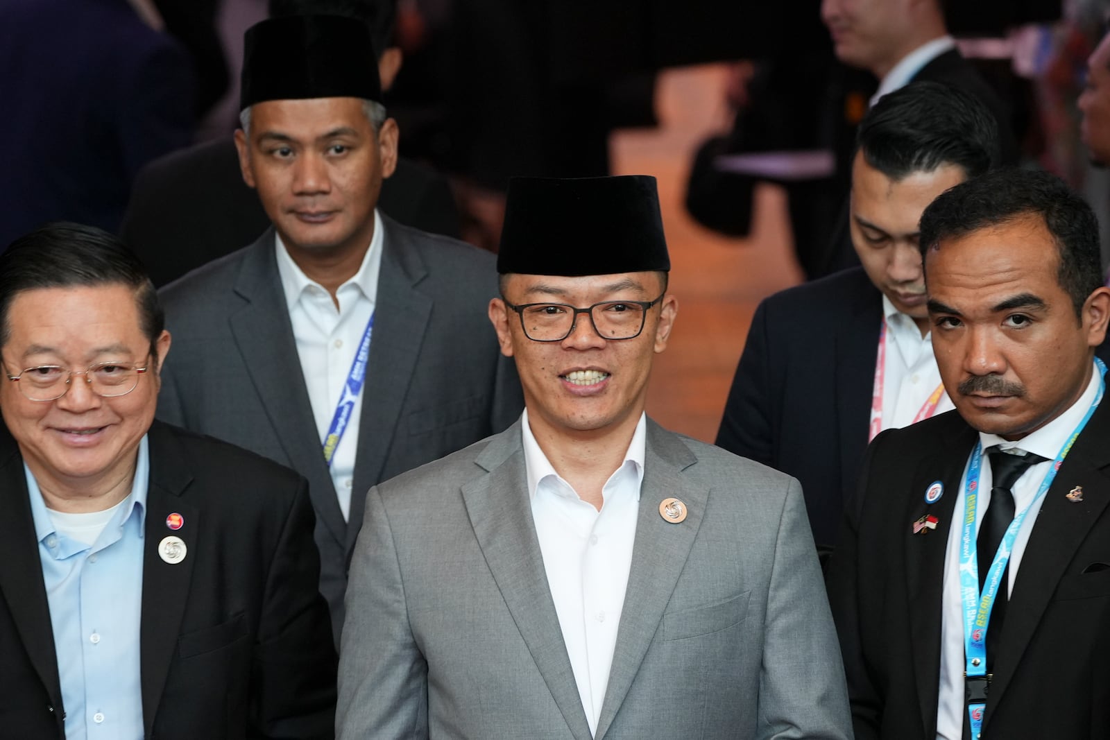 Indonesia's Foreign Minister Sugiono, centre, leaves after the Association of Southeast Asian Nations (ASEAN) Foreign Ministers' Retreat in Langkawi Island, Malaysia, Sunday, Jan. 19, 2025. (AP Photo/Azneal Ishak, Pool)