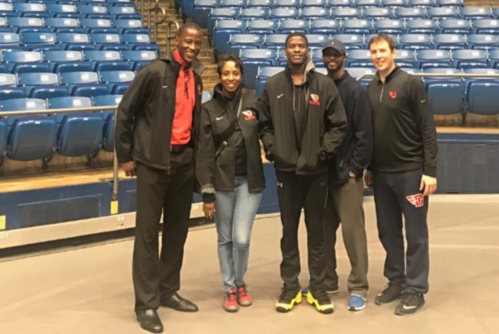 Jalen Crutcher poses with his parents, Shelia and Greg Crutcher, and Dayton coaches Anthony Grant, left, and James Kane, right, at UD Arena. Contributed photo