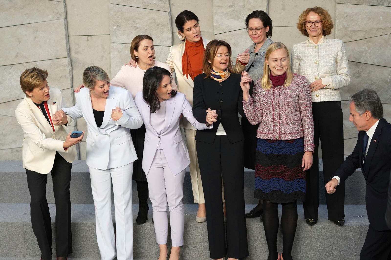 United States Secretary of State Antony Blinken, right, joins a group photo of from left, Latvia's Foreign Minister Baiba Braze, Canada's Foreign Minister Melanie Joly, Romania's Foreign Minister Luminita-Teodora Odobescu, Germany's Foreign Minister Annalena Baerbock, Iceland's Foreign Minister Thordis Kolbrun Reykfjord Gylfadottir, Slovenia's Foreign Minister Tanja Fajon, Sweden's Foreign Minister Maria Malmer Stenergard, Finland's Foreign Minister Elina Valtonen and NATO Deputy Secretary General Radmila Shekerinska during a meeting of NATO foreign ministers at NATO headquarters in Brussels, Wednesday, Dec. 4, 2024. (AP Photo/Virginia Mayo)