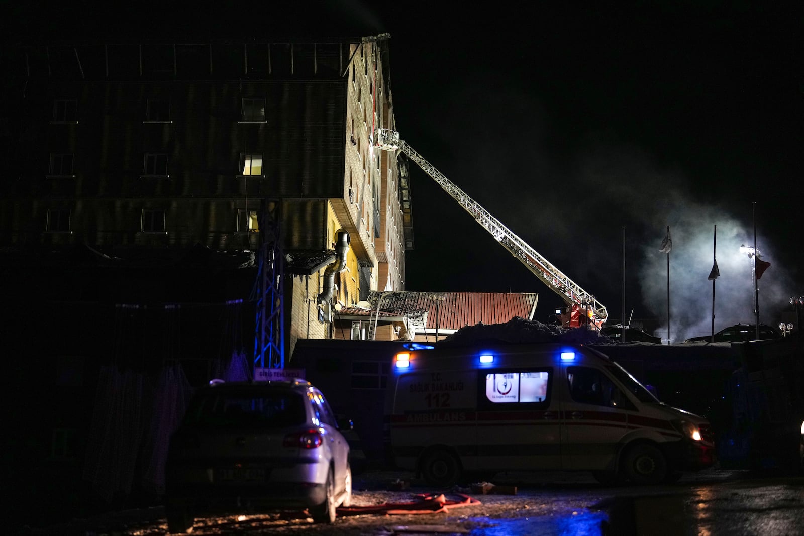 Firefighters and emergency teams work after a fire that broke out at a hotel in the ski resort of Kartalkaya, located in Bolu province, northwest Turkey, on Tuesday, Jan. 21, 2025. (AP Photo/Francisco Seco)