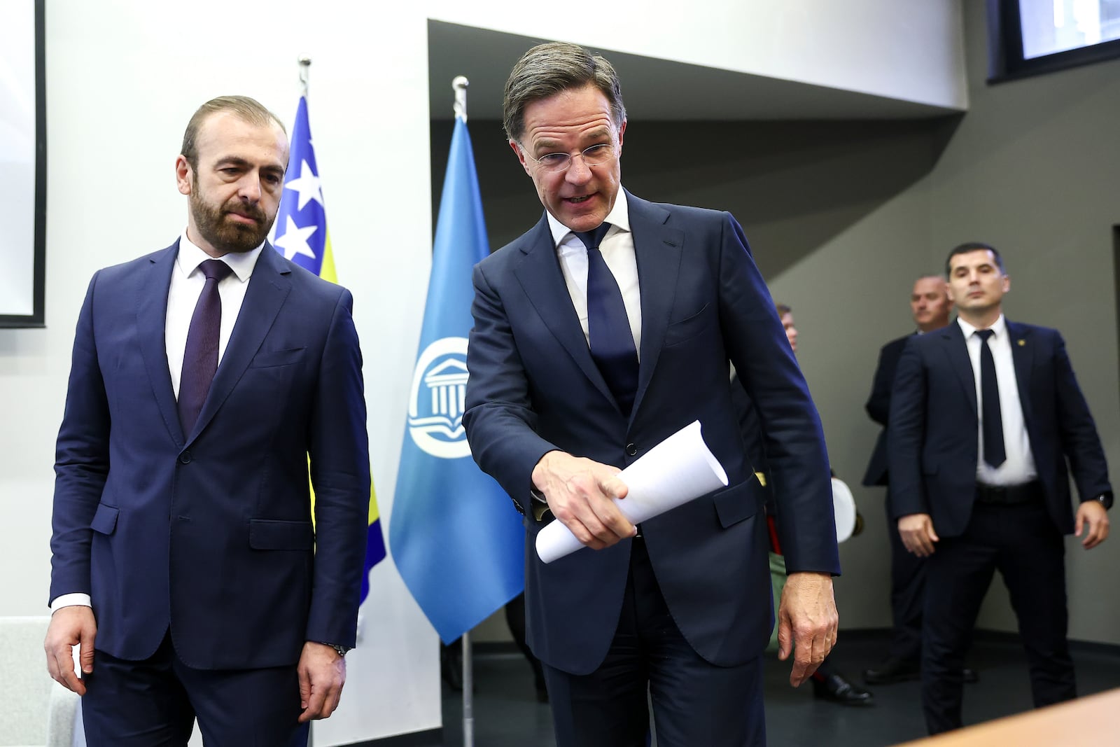 NATO Secretary General Mark Rutte, right, arrives with Sead Turcalo, dean of the Faculty of Political Sciences, to give a lecture to students in Sarajevo, Bosnia, Monday, March 10, 2025. (AP Photo/Armin Durgut)