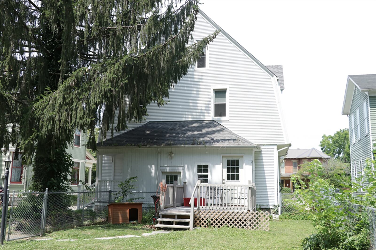 The 2-story has a covered front porch, rear composite deck within a fenced back yard. A door with the original doorbell opens from the dining room to the porch. CONTRIBUTED PHOTO BY KATHY TYLER