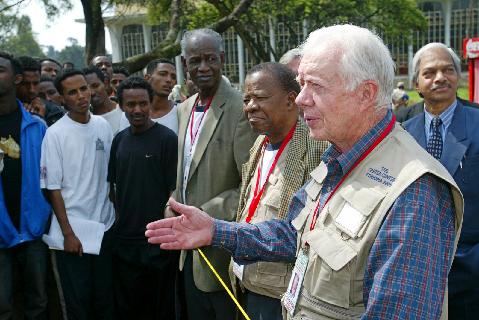 FILE - Former U.S. President Jimmy Carter, right, former Botswanan President Ketumile Joni Masire, center, and former Tanzanian Prime Minister Joseph Warioba, fourth from right, address members of the media at a polling station at the university in Addis Ababa, during the third democratic elections in Ethiopia's 3,000-year history, May 15, 2005. (AP Photo/Karel Prinsloo, File)