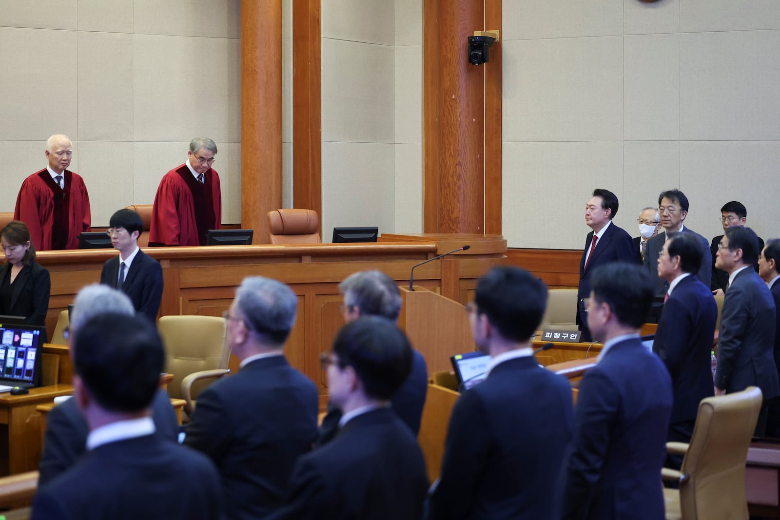 Impeached South Korean President Yoon Suk Yeol, fourth from top right, attends his impeachment trial at the Constitutional Court in Seoul, South Korea, Tuesday, Jan. 21, 2025. (Kim Hong-Ji/Pool Photo via AP)