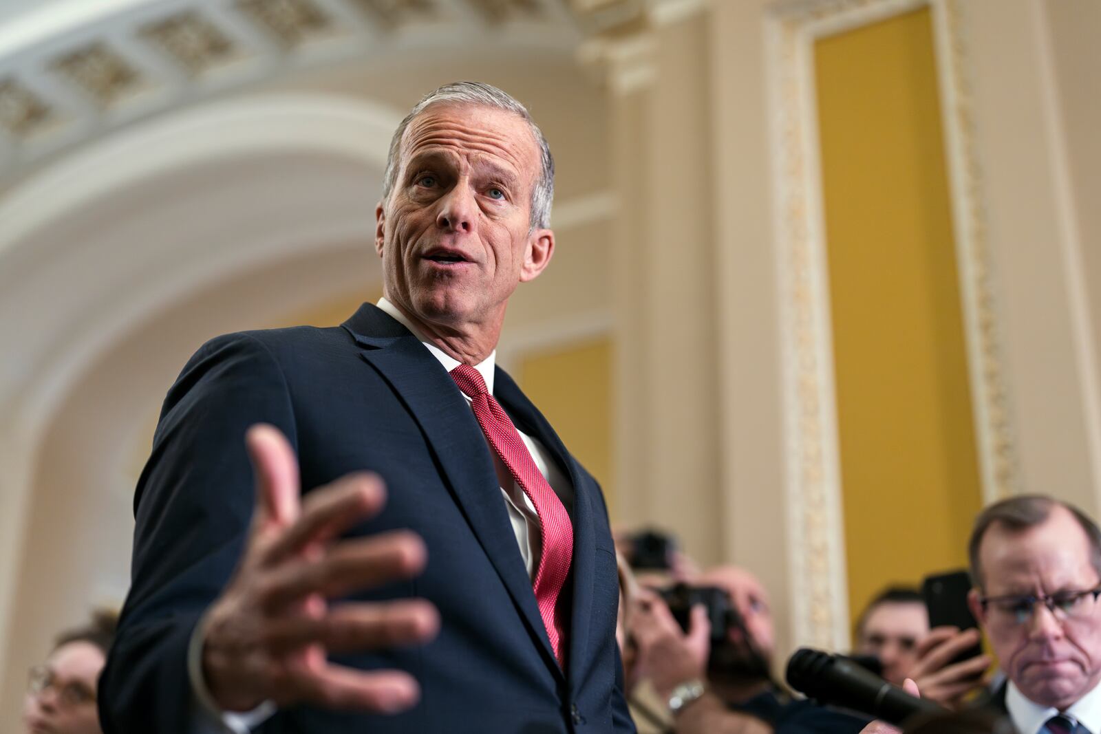 Senate Majority Leader John Thune, R-S.D., speaks to reporters after meeting with Vice President JD Vance and fellow Republicans to discuss President Donald Trump's agenda at a luncheon, at the Capitol in Washington, Wednesday, Feb. 19, 2025. (AP Photo/J. Scott Applewhite)