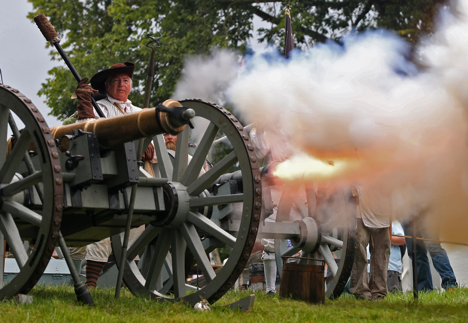 Members of the First Mad River Light Artillery fire their cannon Saturday morning at the Fair at New Boston. BILL LACKEY/STAFF