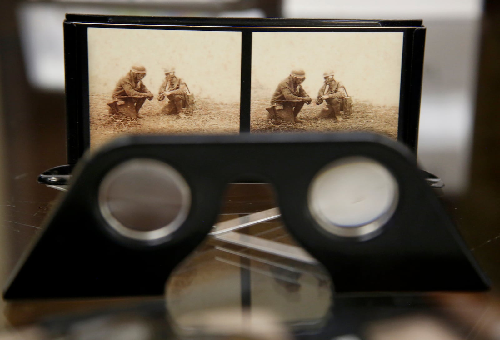 Images of World War I can be seen through a stereopticon at the Miami Valley Military History Museum. LISA POWELL / STAFF