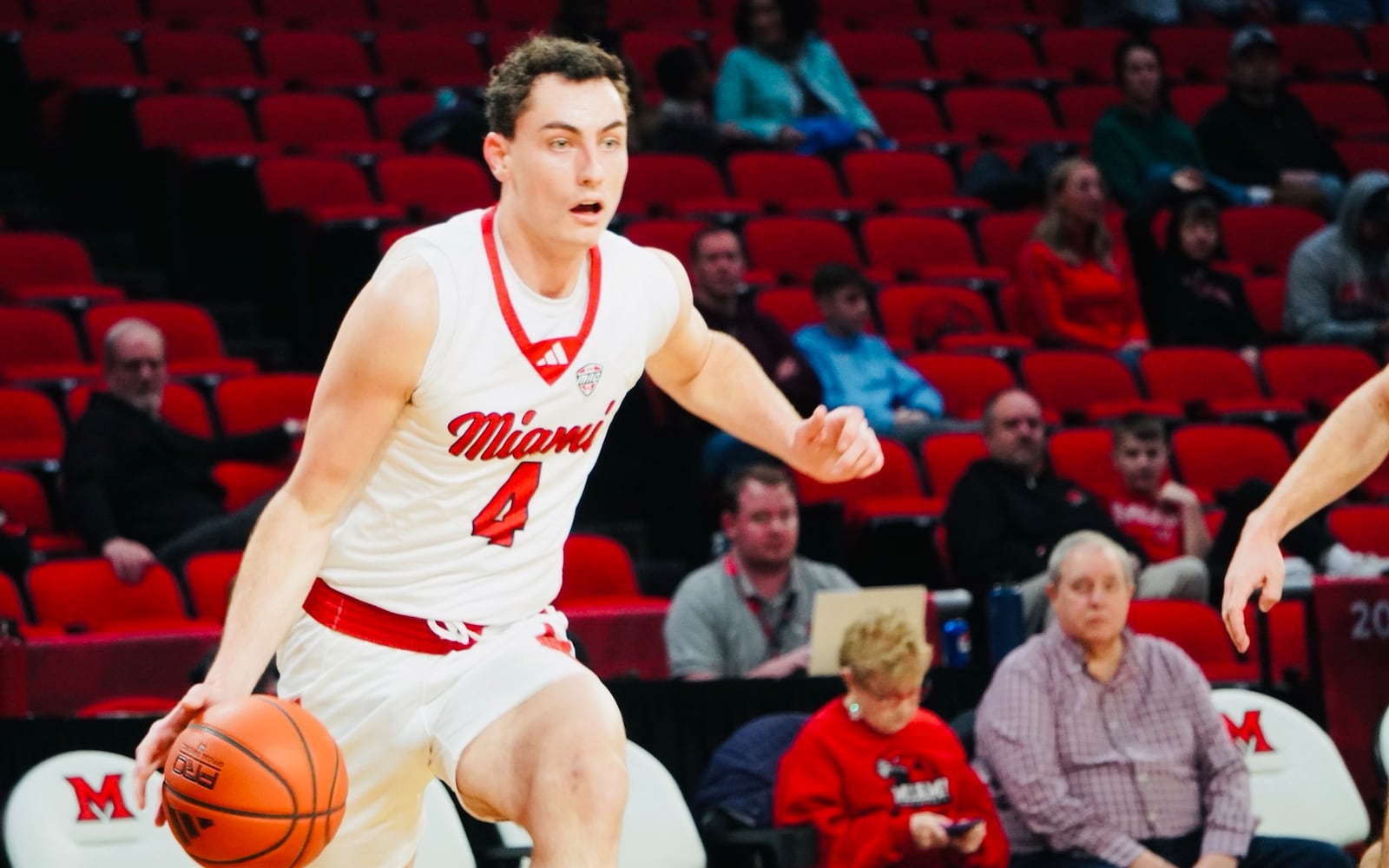 Miami's Kam Craft dribbles the ball down court against Bethany on Sunday afternoon at Millett Hall. Craft scored a career-high 34 points. Chris Vogt/CONTRIBUTED